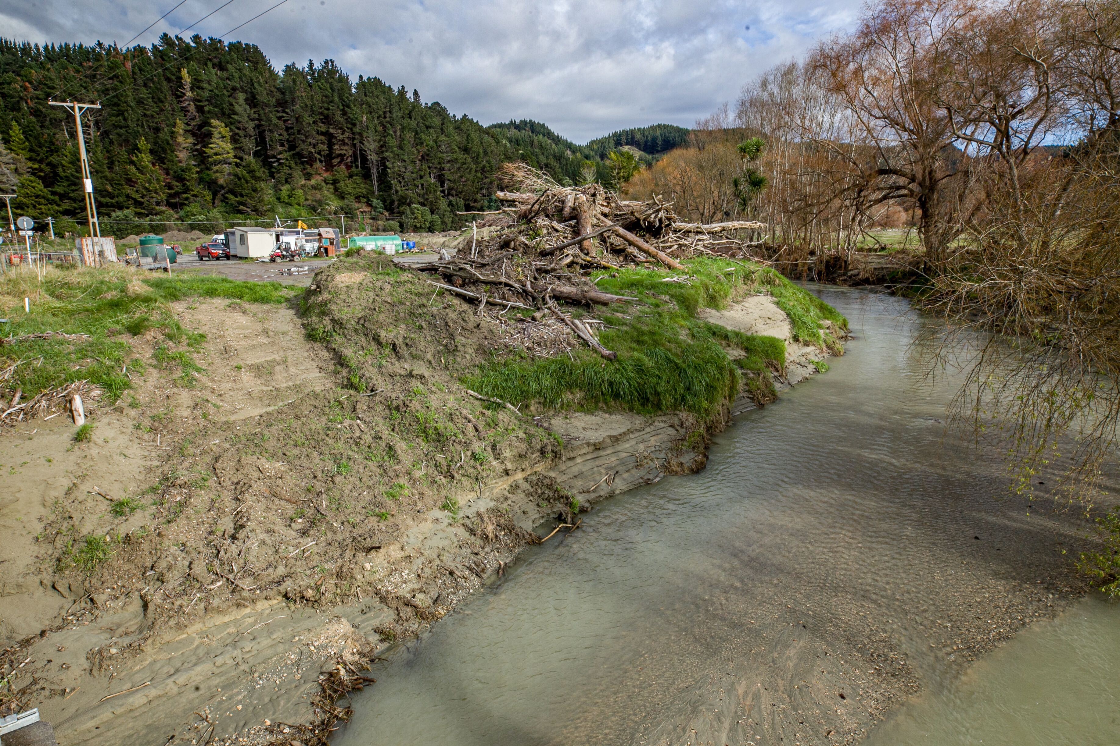 Debris and silt piled alongside a creek close to Tangoio Marae, an area hit hard by the February cyclone and which is now zoned Category 3. Photo / Warren Buckland