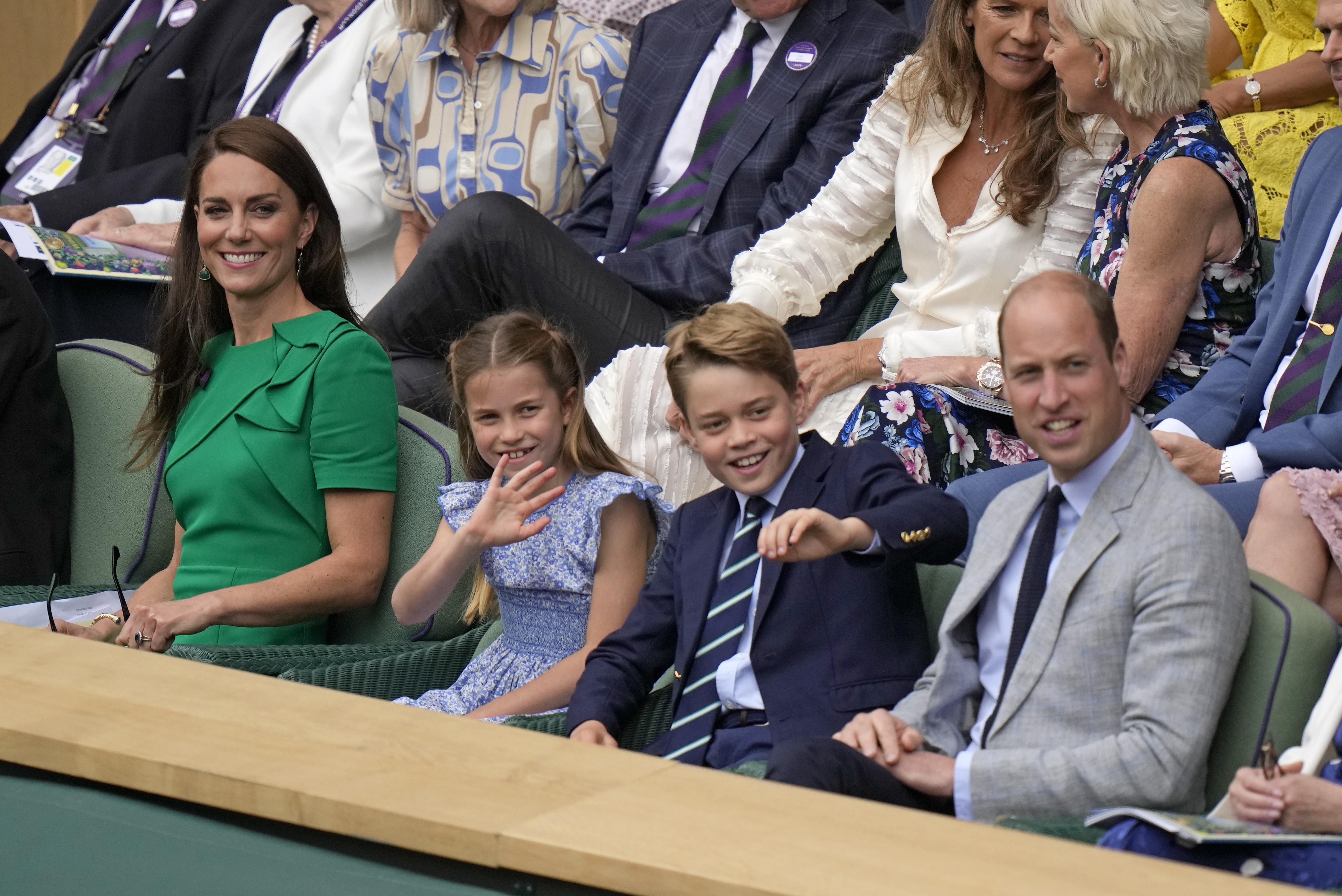 Princess Kate, Princess Charlotte, Prince George and Prince William sit in the Royal Box on Centre Court. Photo / AP