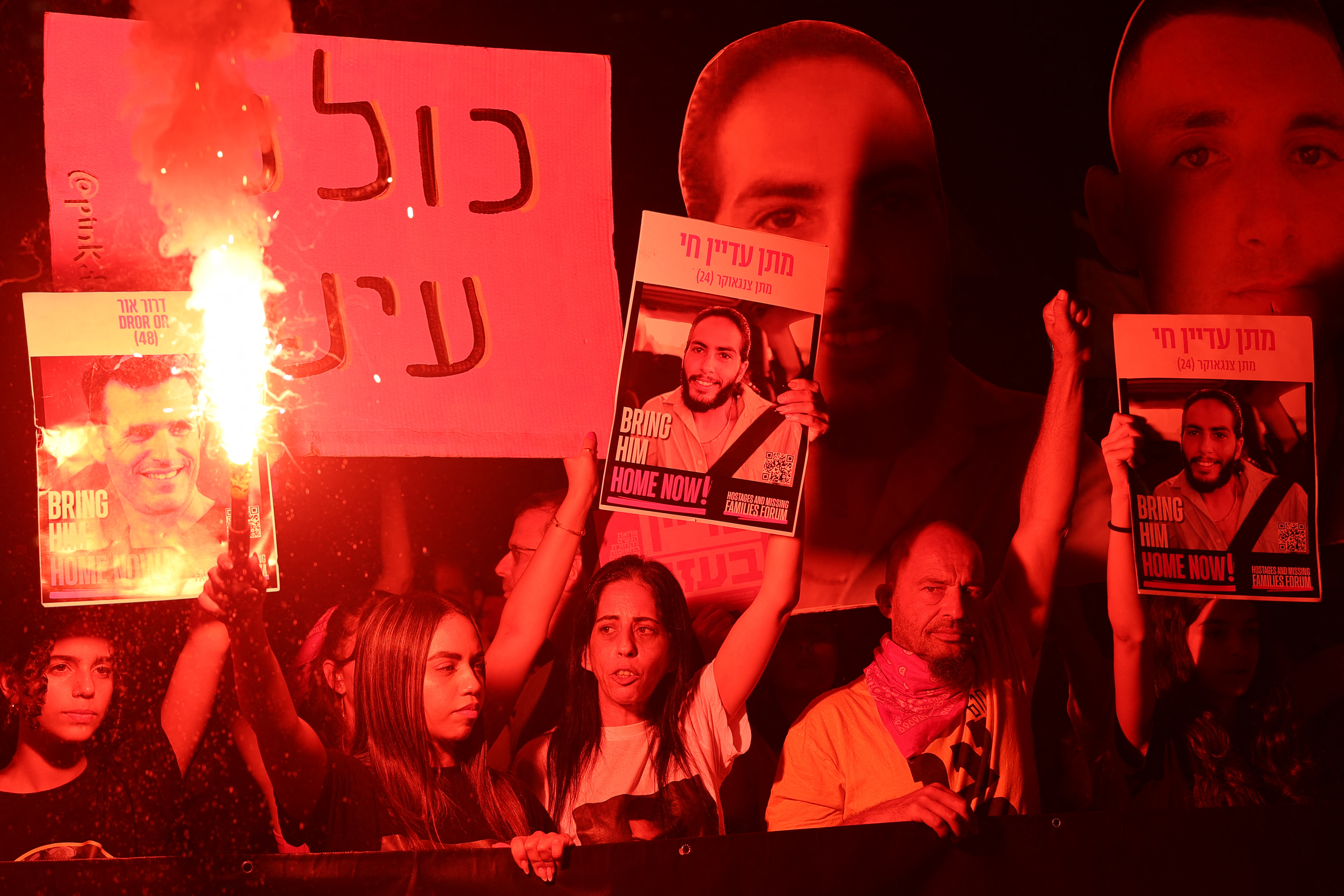 Demonstrators carry placards during an anti-government protest calling for action to secure the release of Israeli hostages held captive since the October 7, 2023 attacks by Palestinian militants, in front of the Defence Ministry in Tel Aviv on June 7 amid the ongoing war with the Palestinian militant movement Hamas. Photo / AFP