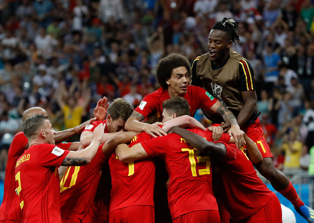 Belgium players celebrate a famous win over Japan at the Fifa World Cup. Photo / AP