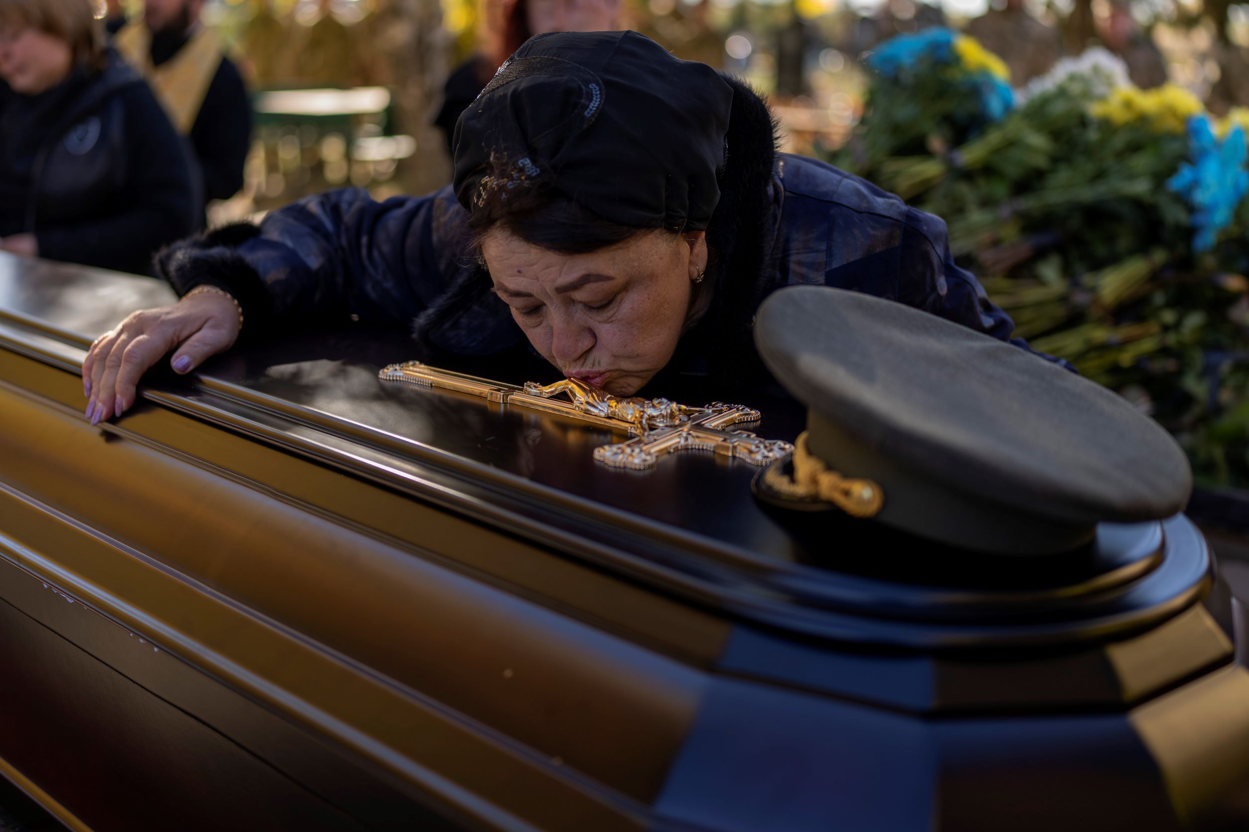 Tatiana Alexeyevna mourns over the coffin of her son Colonel Oleksiy Telizhenko during his funeral in Bucha, near Kyiv, Ukraine, in October. In March, Colonel Oleksiy was abducted by Russian soldiers from his home in Bucha, six months later his body was found with signals of torture buried in a forest not far away from his village. Photo / AP 