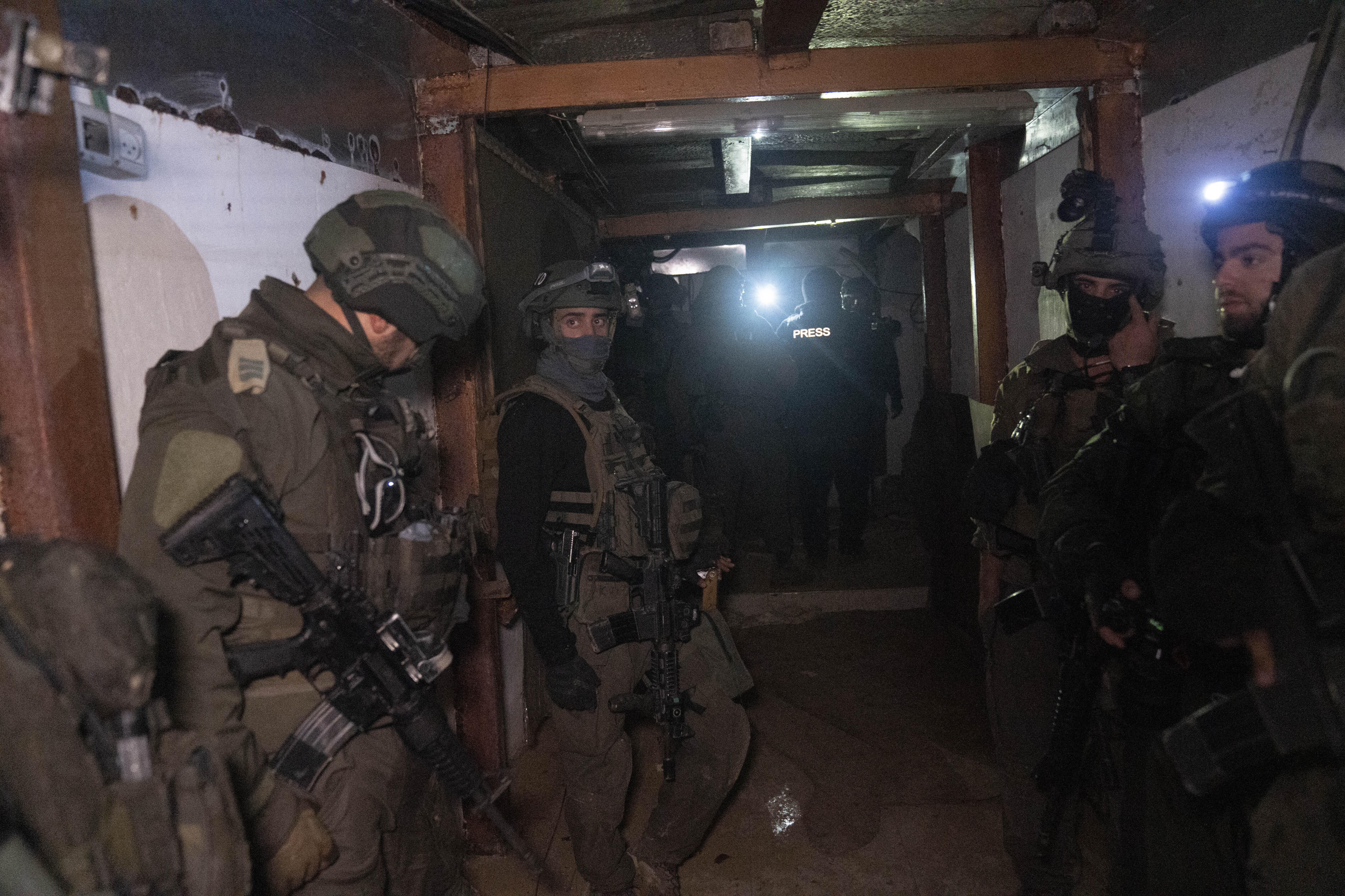 Israeli soldiers in a Hamas tunnel underneath a cemetery during the ground offensive on the Gaza Strip in Khan Younis. Photo / AP