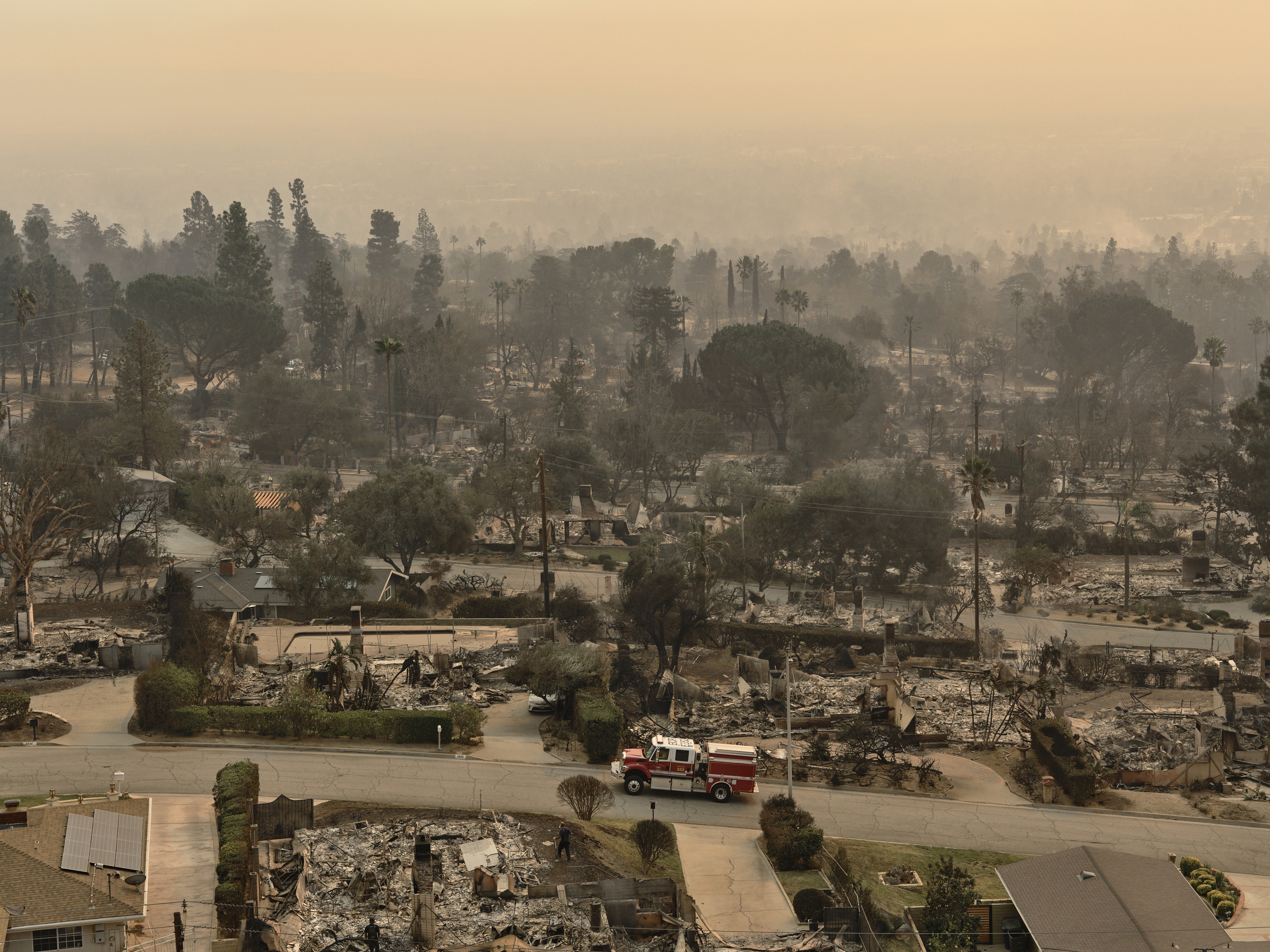 Smoke rises from a residential neighbourhood during the Eaton fire in Altadena, California, on January 9. Photo / Philip Cheung, The New York Times