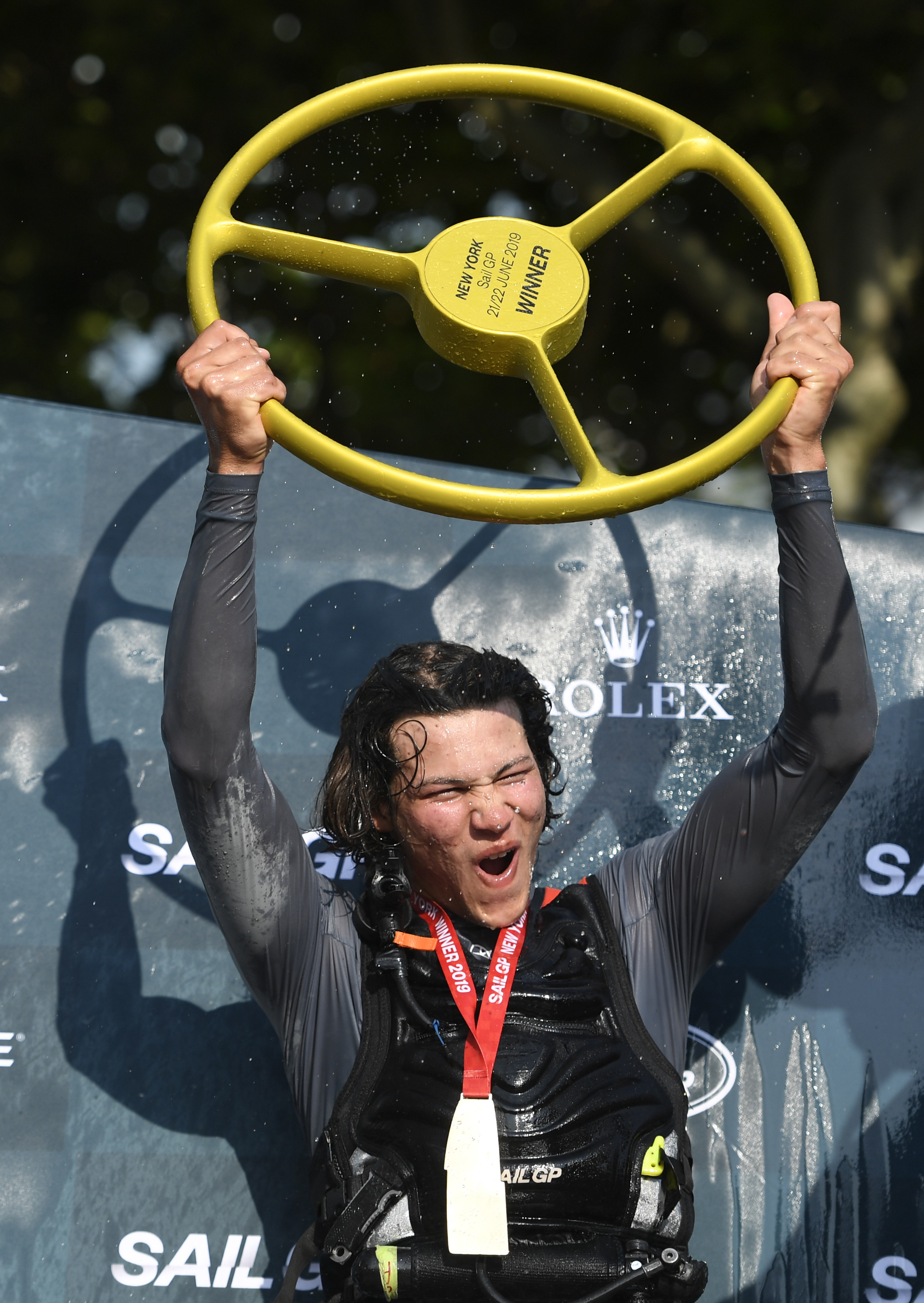 Leo Takahashi raises the trophy after the Japanese team wins day two of competition at the SailGP event on June 22, 2019, in New York City. Photo / Getty Images