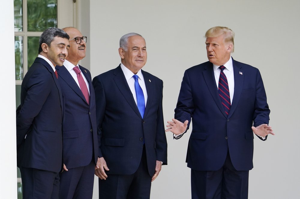 Donald Trump, right, leads from left, Abdullah bin Zayed al-Nahyan, Khalid bin Ahmed Al Khalifa and Benhamin Netanyahu at the signing ceremony. Photo / AP 