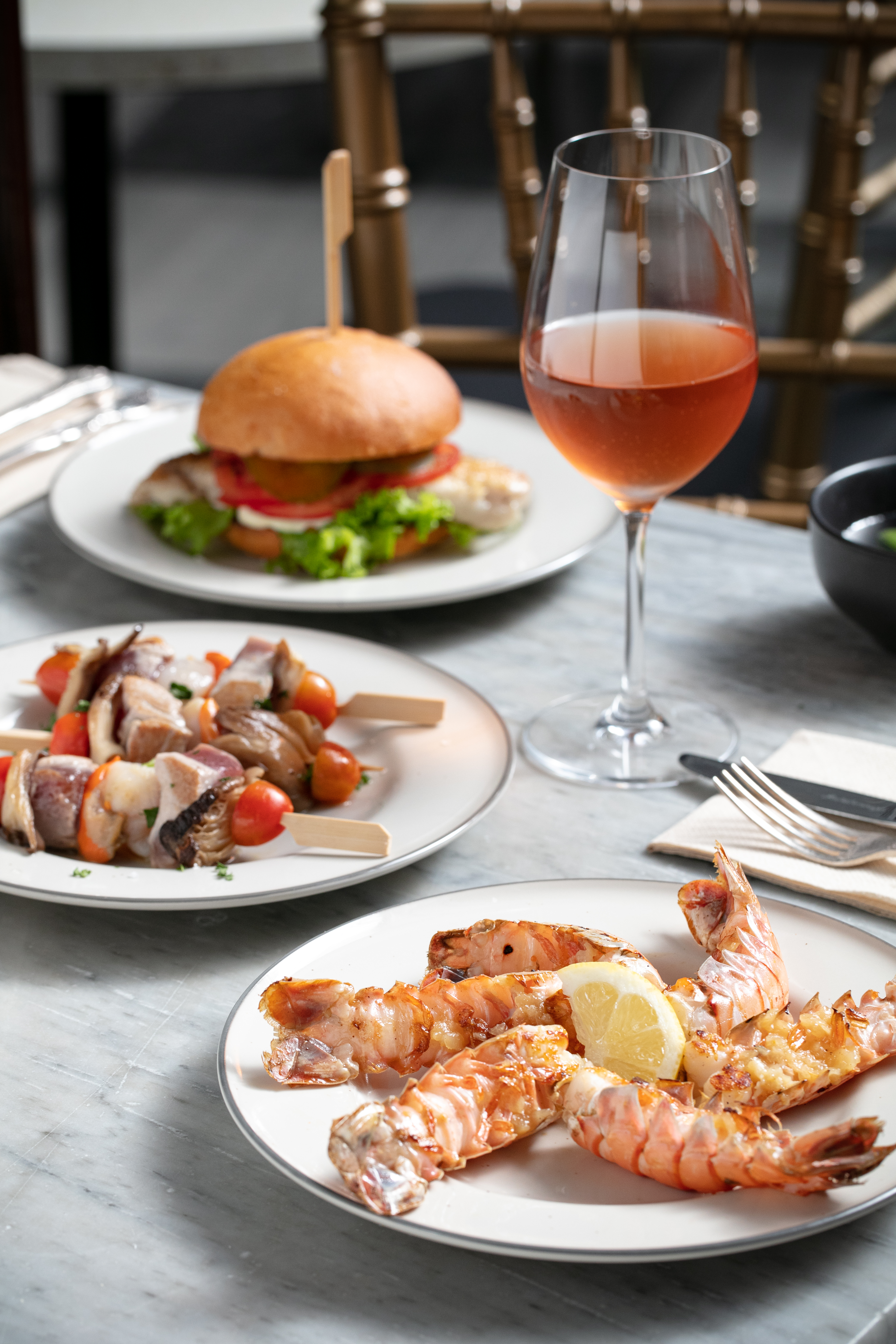 The fish burger, scampi and tuna and scallop skewers on the menu at Underground Bistro in St Kevins Arcade. Photo / Babiche Martens