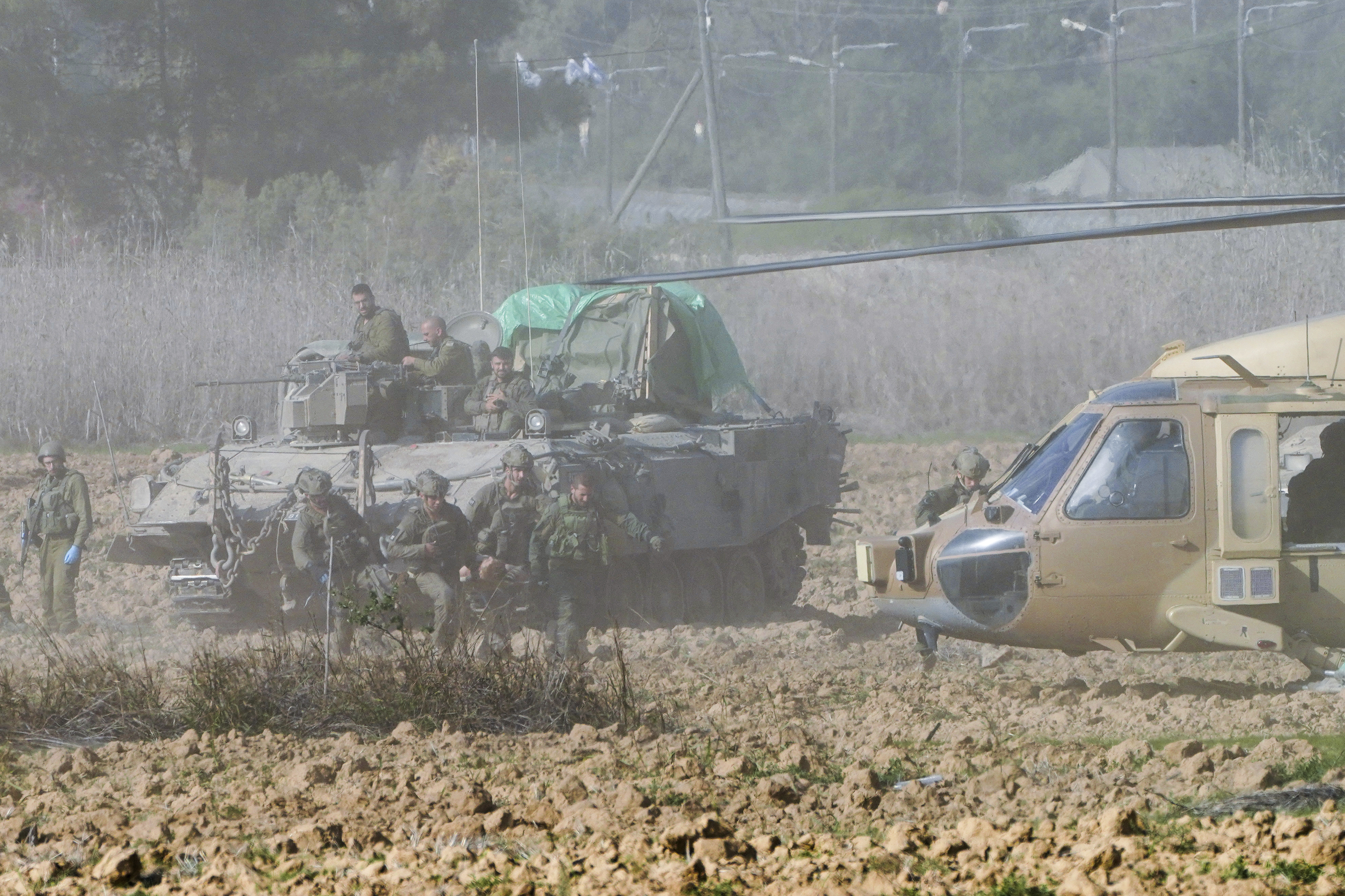 Israeli forces evacuate a wounded soldier from Gaza near the border with southern Israel. Photo / AP