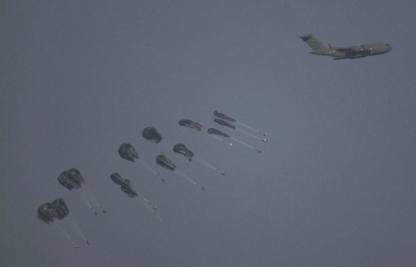 An aircraft airdrops humanitarian aid over the northern Gaza Strip on Thursday, March 28. Photo / AP