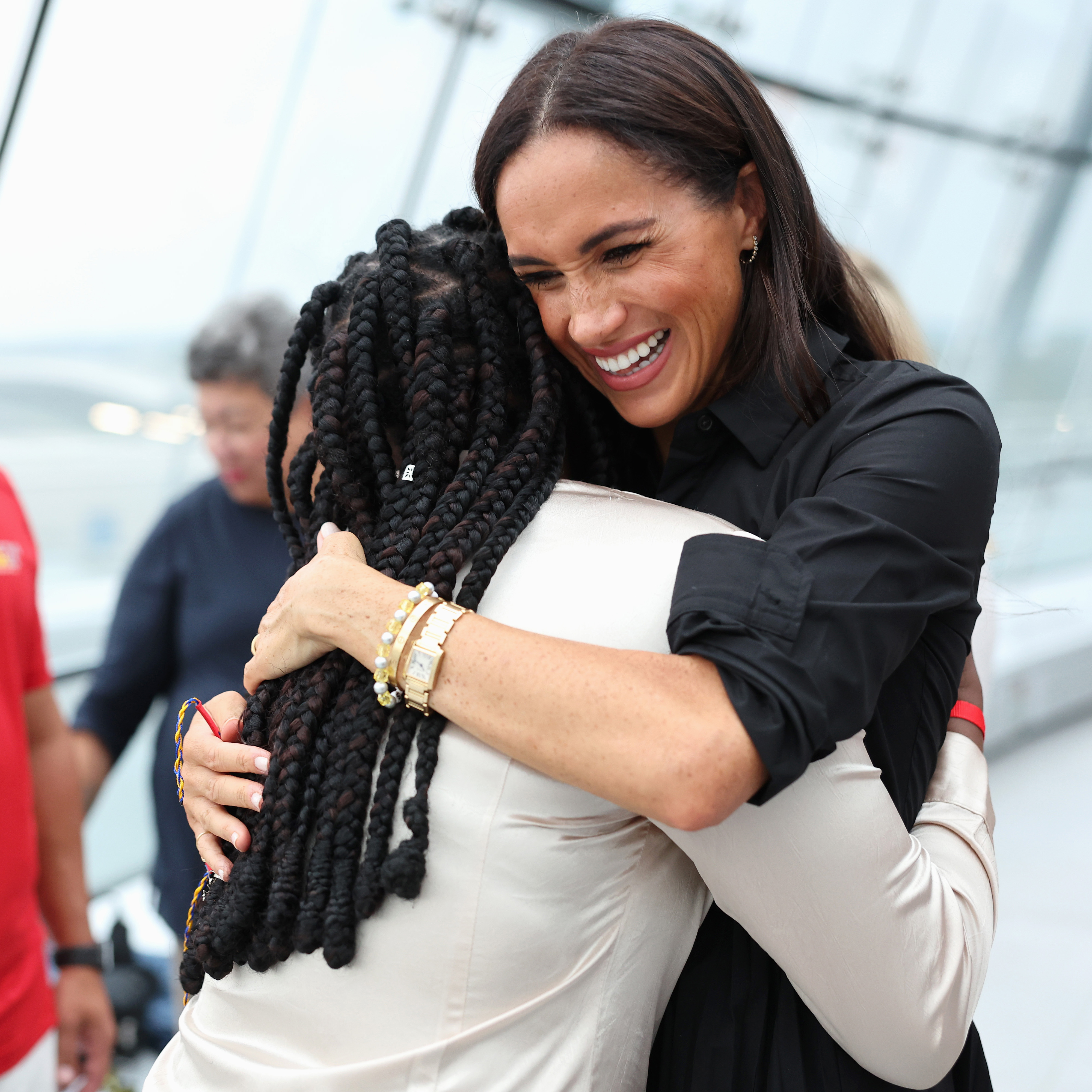 Meghan meets Glory Essien at the Friends @ Home Event. Photo / Getty Images