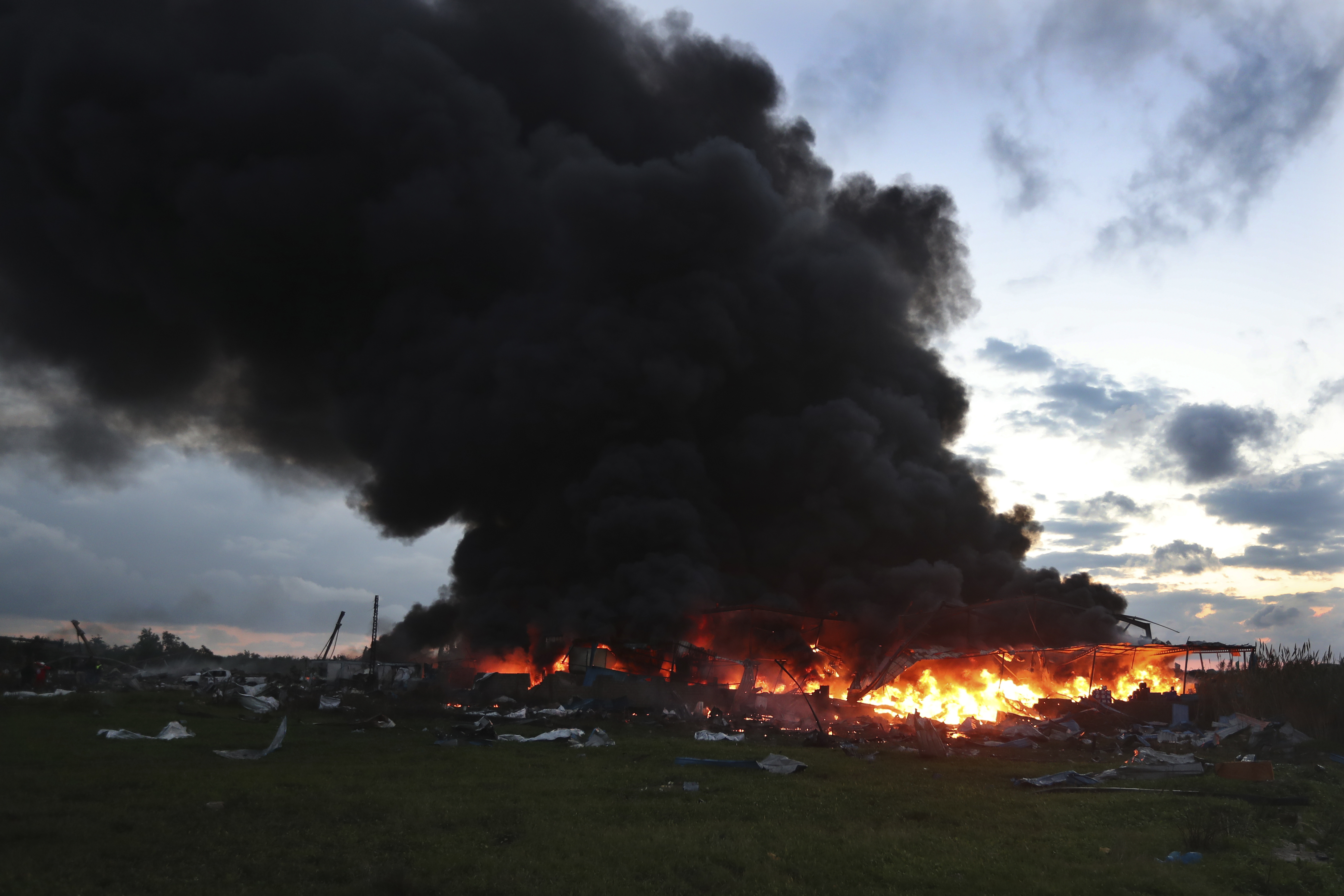 Black smoke and flames rise from a burning warehouse, hit by Israeli airstrikes, at an industrial district in the southern coastal town of Ghazieh, Lebanon. Photo / AP