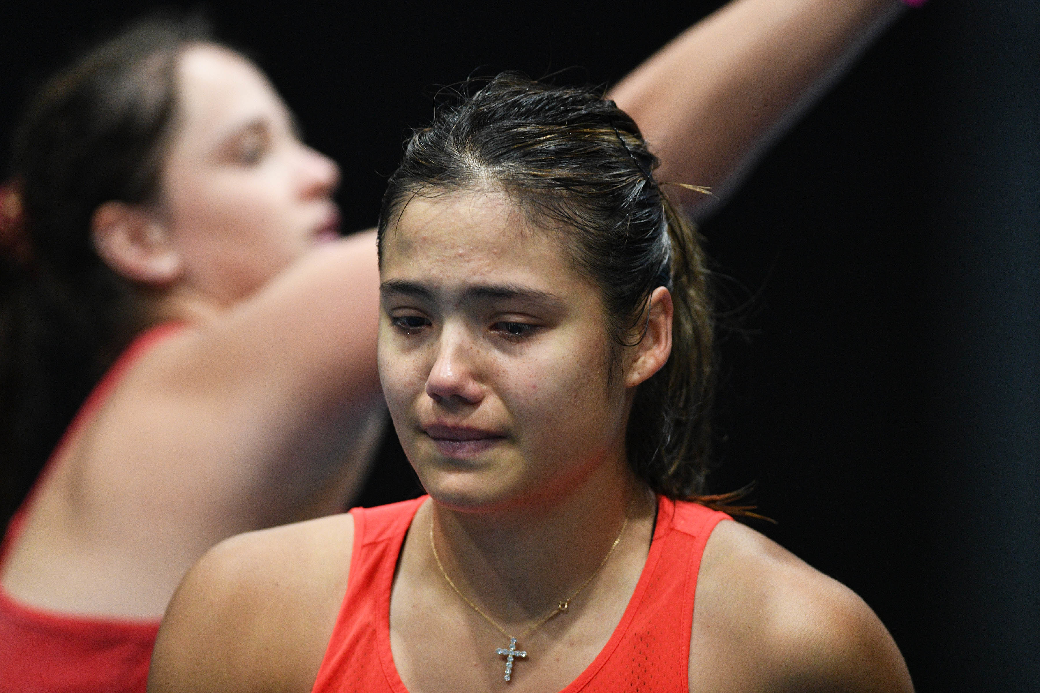 An upset Emma Raducanu was forced to retire hurt against Viktoria Kuzmova after rolling her ankle. Photo / Photosport