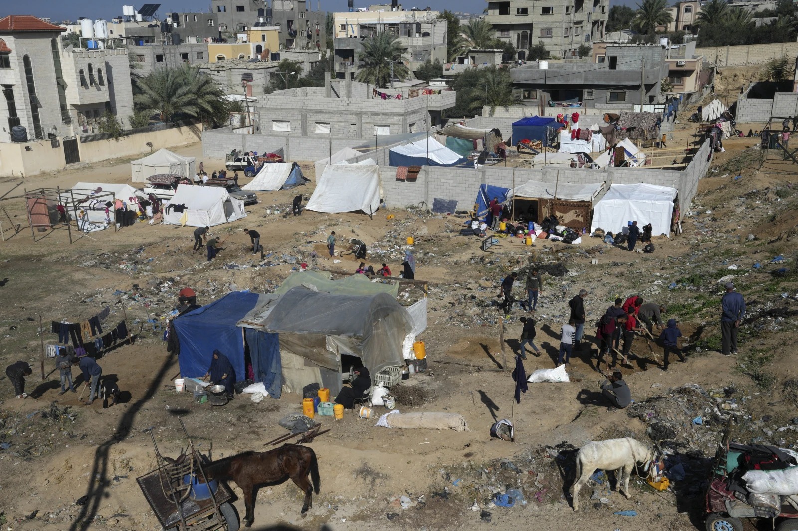 Palestinians displaced by the Israeli bombardment of the Gaza Strip set up tents in Deir al Balah. Photo / AP