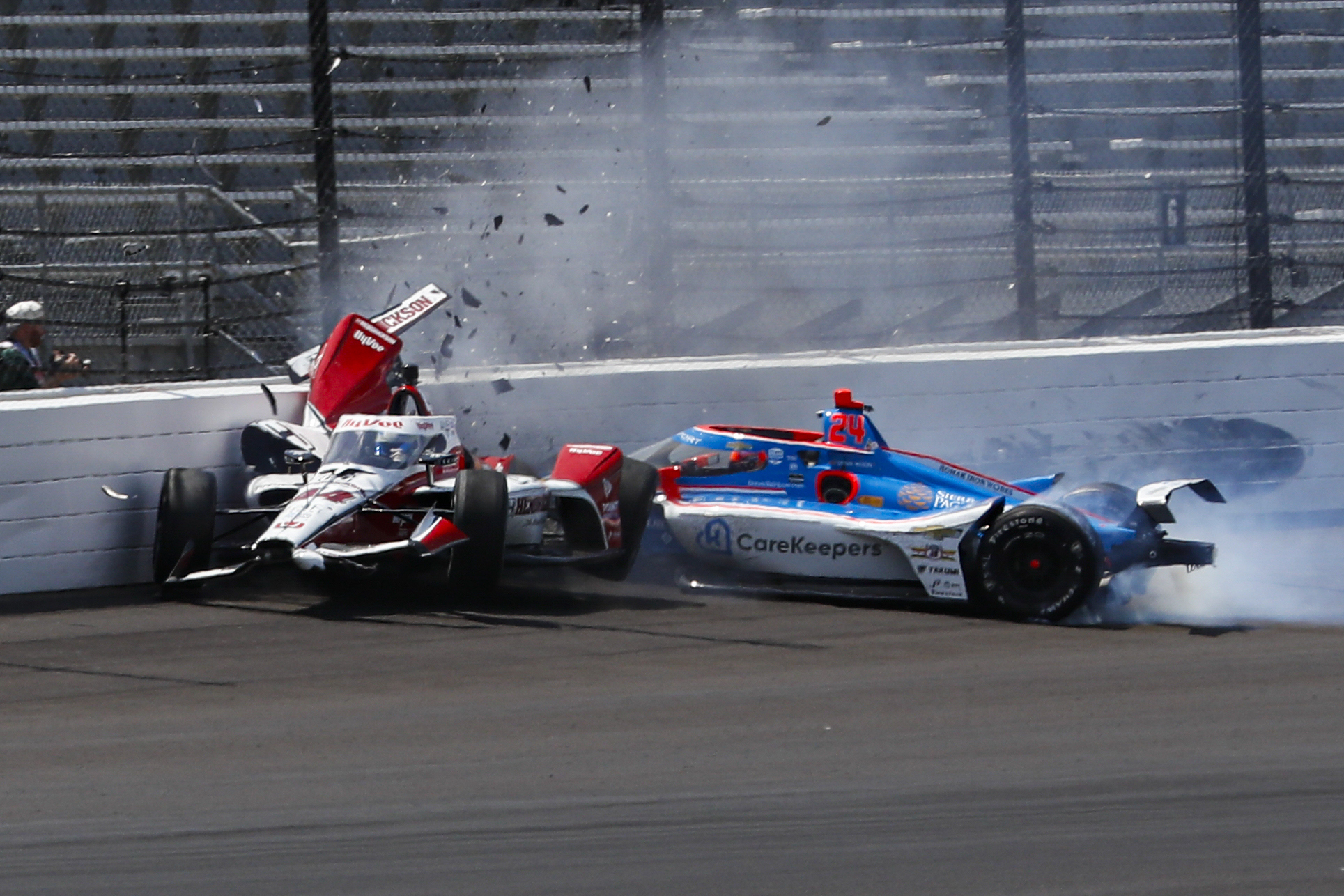 Katherine Legge, of England, left, and Stefan Wilson, of England, crash in the first turn during practice for the Indianapolis 500 auto race at Indianapolis Motor Speedway in Indianapolis. Photo / AP