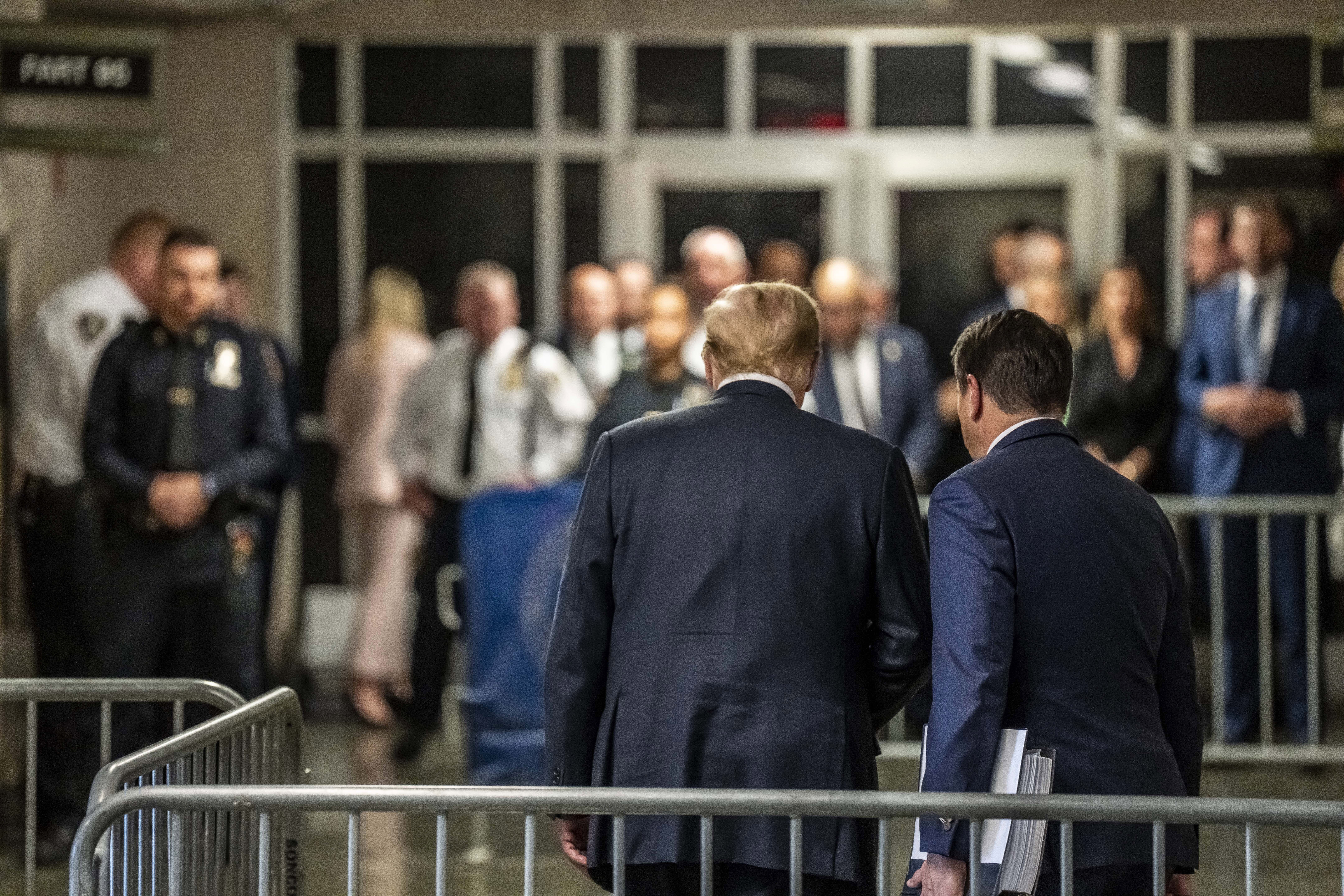 Former President Donald Trump prepares to leave the courthouse with attorney Todd Blanche after speaking to the media after the conclusion of his hush money trial in New York. Photo / Pool via AP