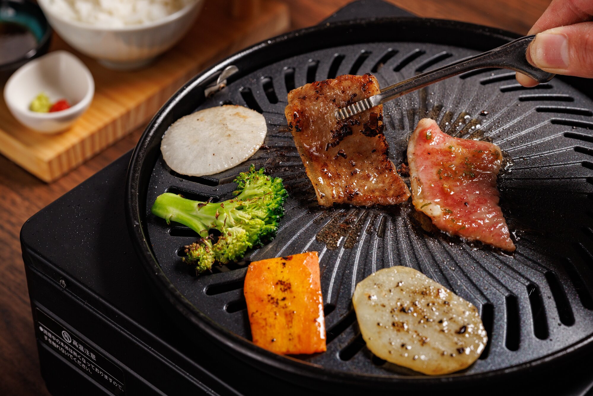At Wagyu Shogun in Royal Oak, you cook your own food over a gas barbecue. Photo / Babiche Martens