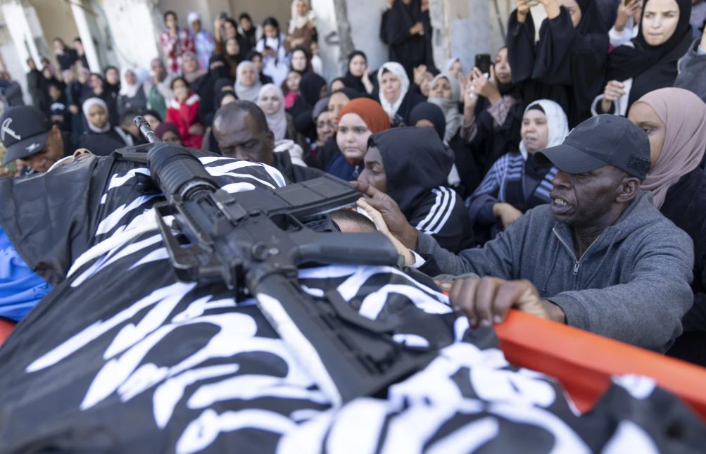 Mourners carry the body of Ahmad Faraj, 18, during his funeral in the West Bank refugee camp of Tulkarem. Photo / AP