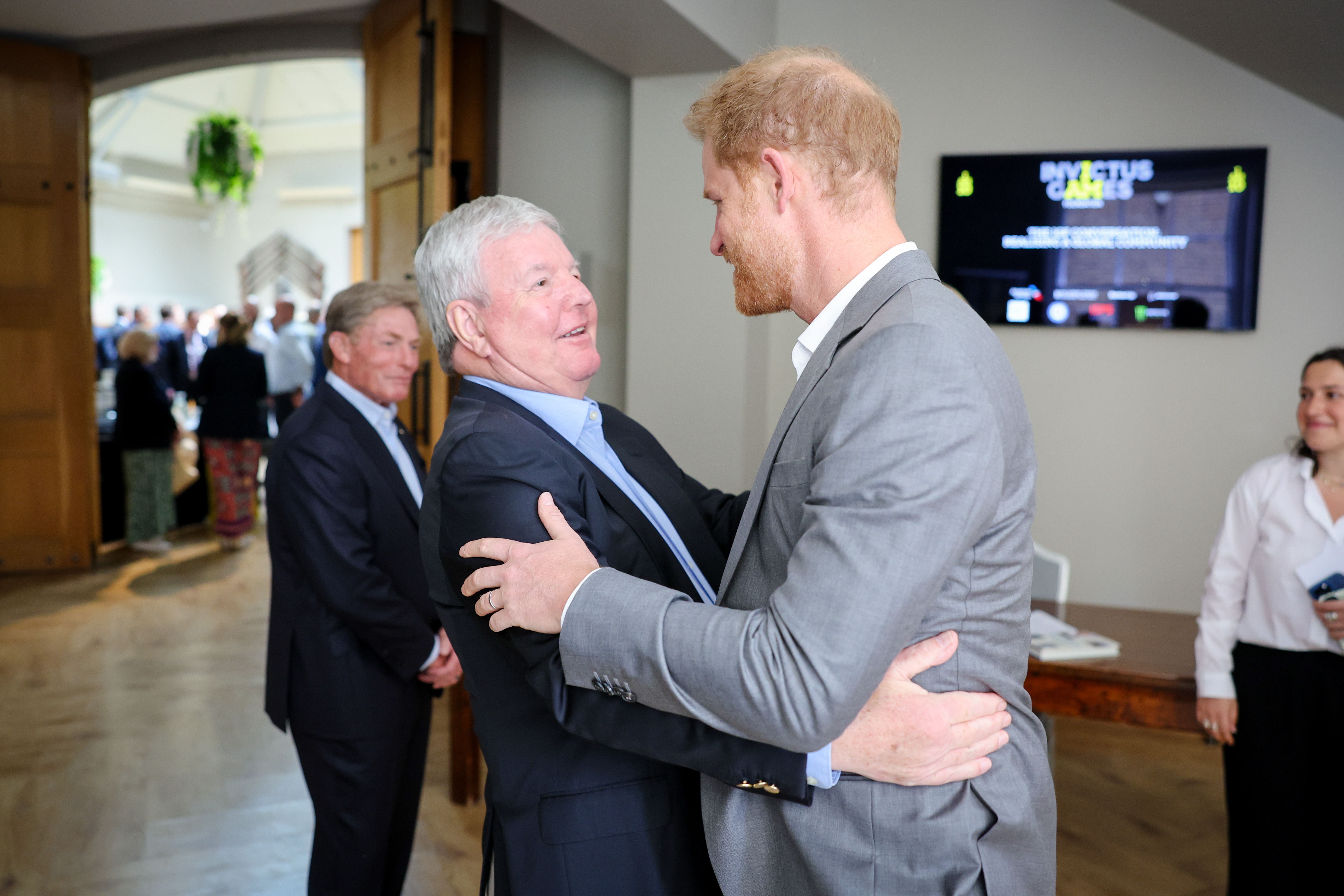 Prince Harry warmly greets Sir Keith Mills, former deputy chairman of the London Organising Committee of the Olympic and Paralympic Games. Photo / Getty Images