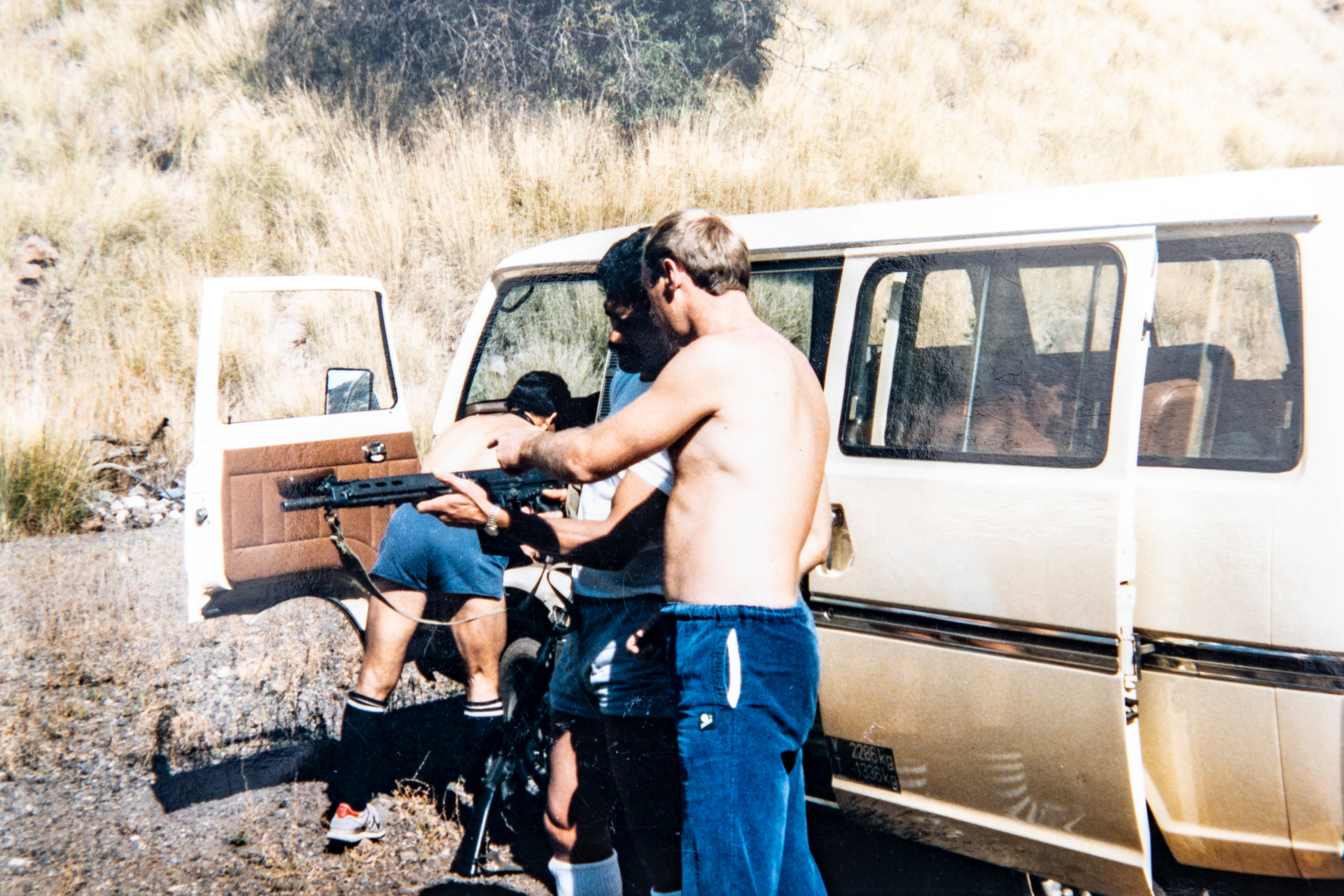 A member of the South African special forces showing Cavaliers squad members who to use a semi automatic rifle on a firing range. Malcolm Hood collection