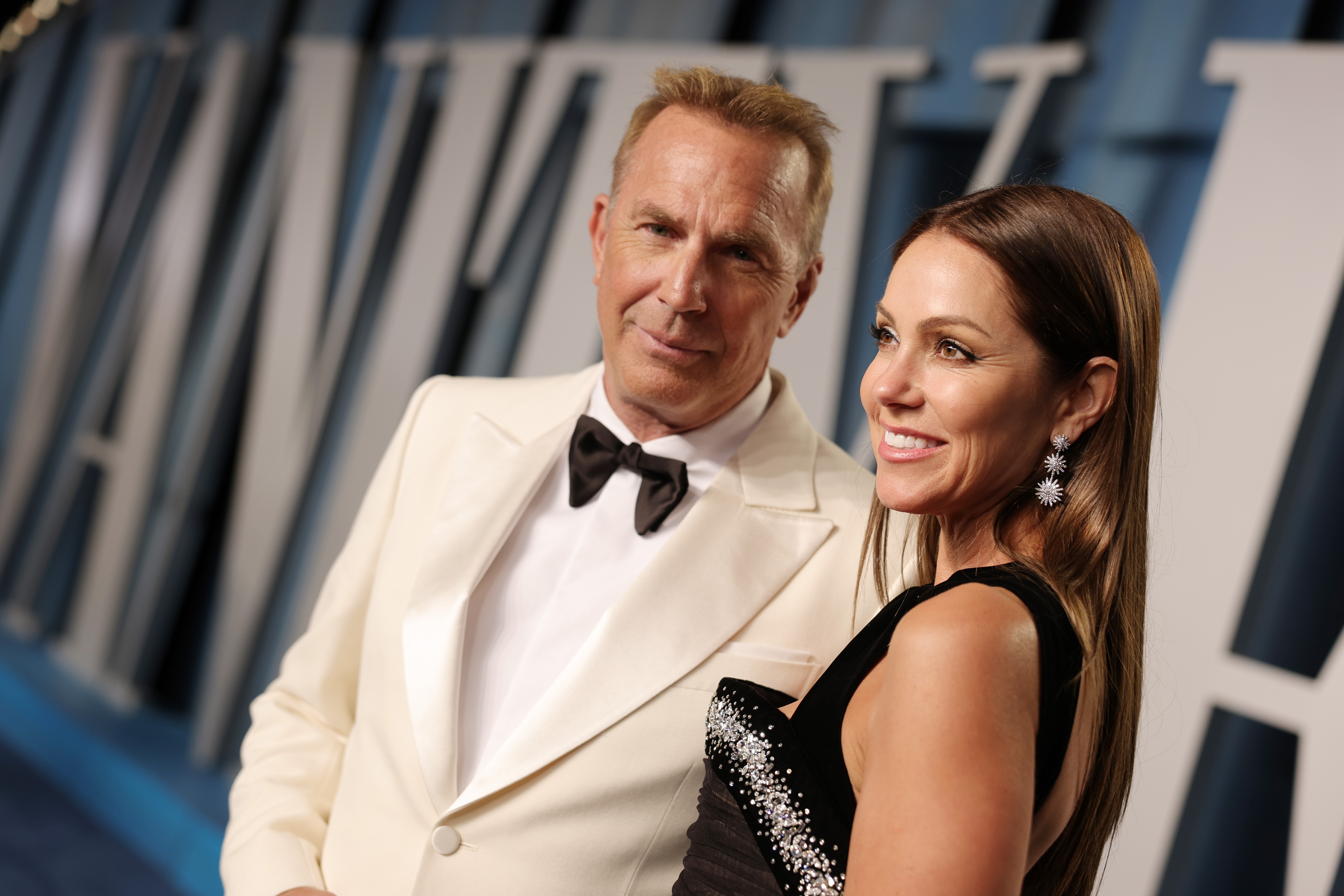 Actor Kevin Costner and his wife, Christine Baumgartner attend the