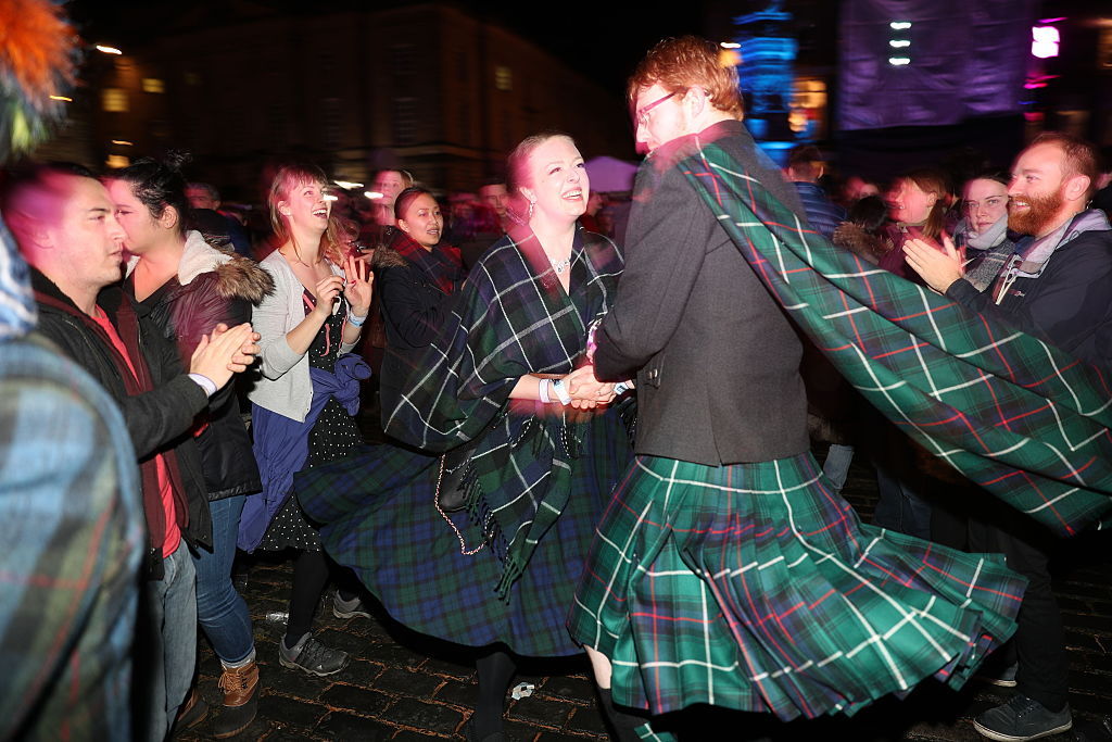 During Hogmanay New Year celebrations the People of Edinburgh ceilidh dance along the Royal Mile. Photo / Andrew Milligan, Getty Images