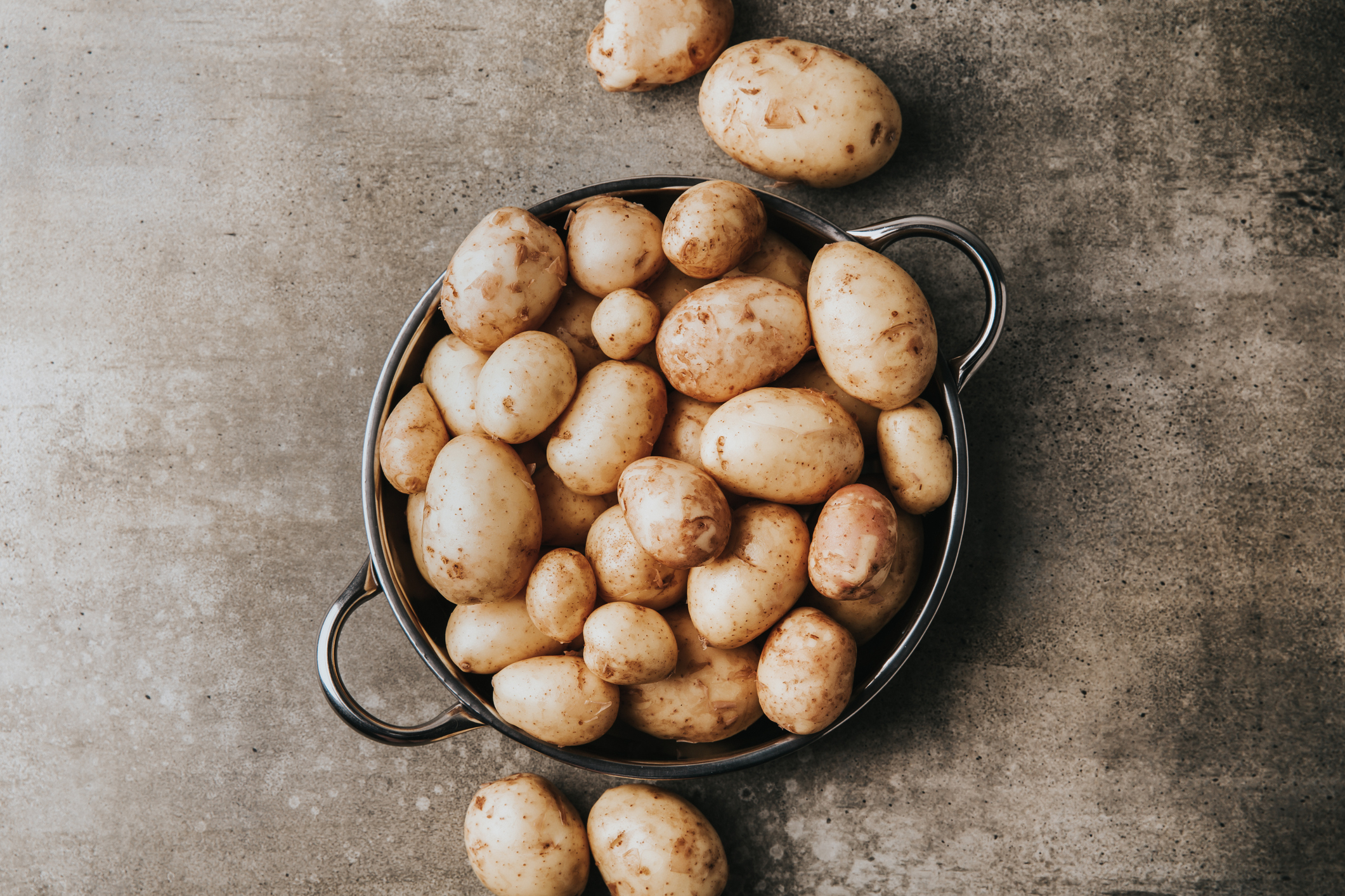 Potatoes need to be stored in a cool, dark place. Photo / Getty Images