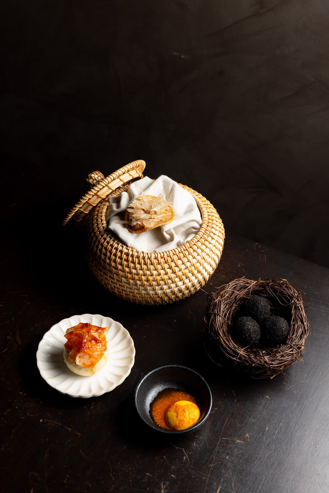 From the snacks menu at modern Samoan restaurant Tala - keke pua’a, quail egg and the taro chip.