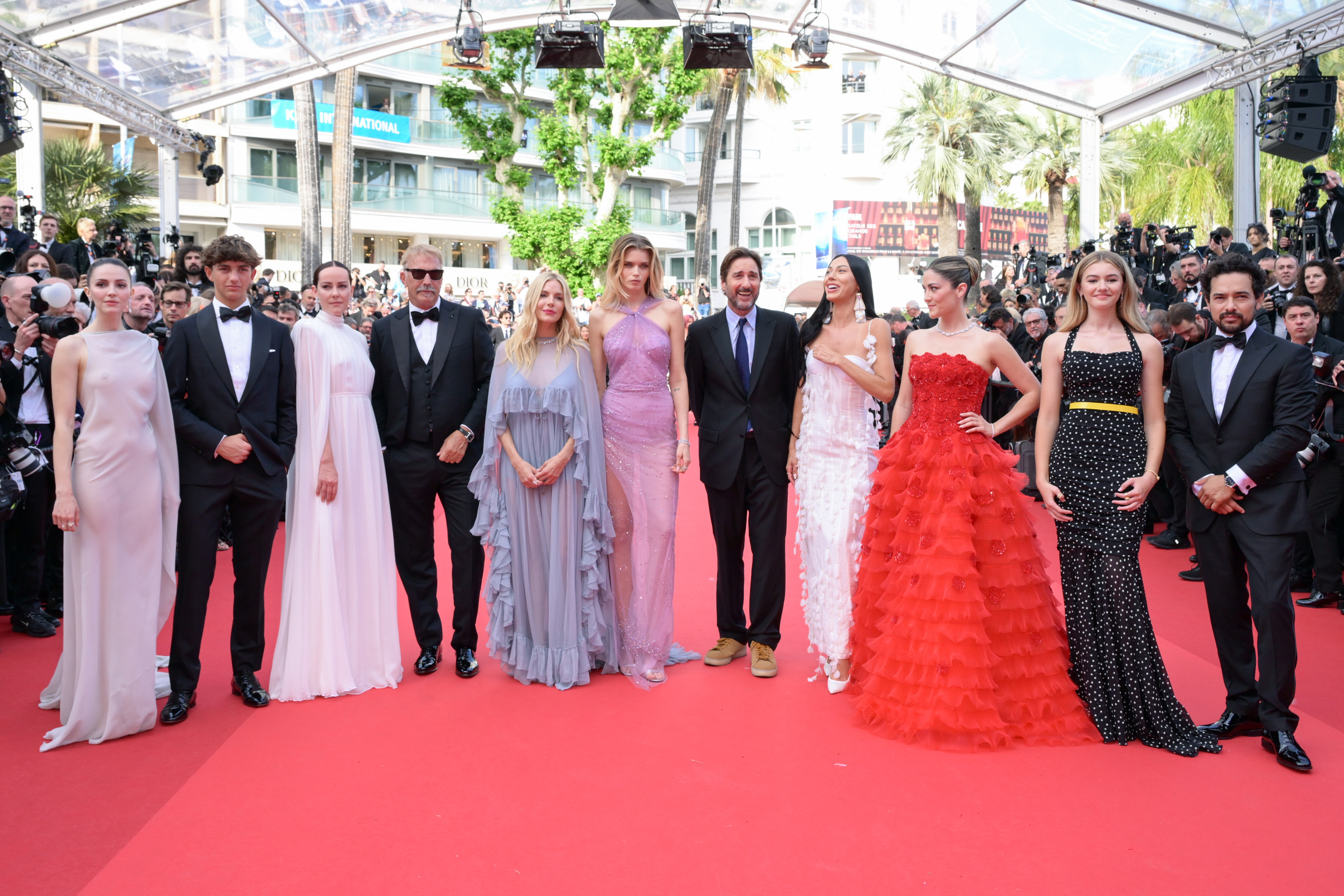 Ella Hunt (from left), Hayes Costner, Jena Malone, Kevin Costner, Sienna Miller, Abbey Lee Kershaw, Luke Wilson, Wasé Chief, Isabelle Fuhrman, Georgia MacPhail, and Alejandro Edda at the Horizon: An American Saga red carpet at the 77th Cannes Film Festival. Photo / Getty Images