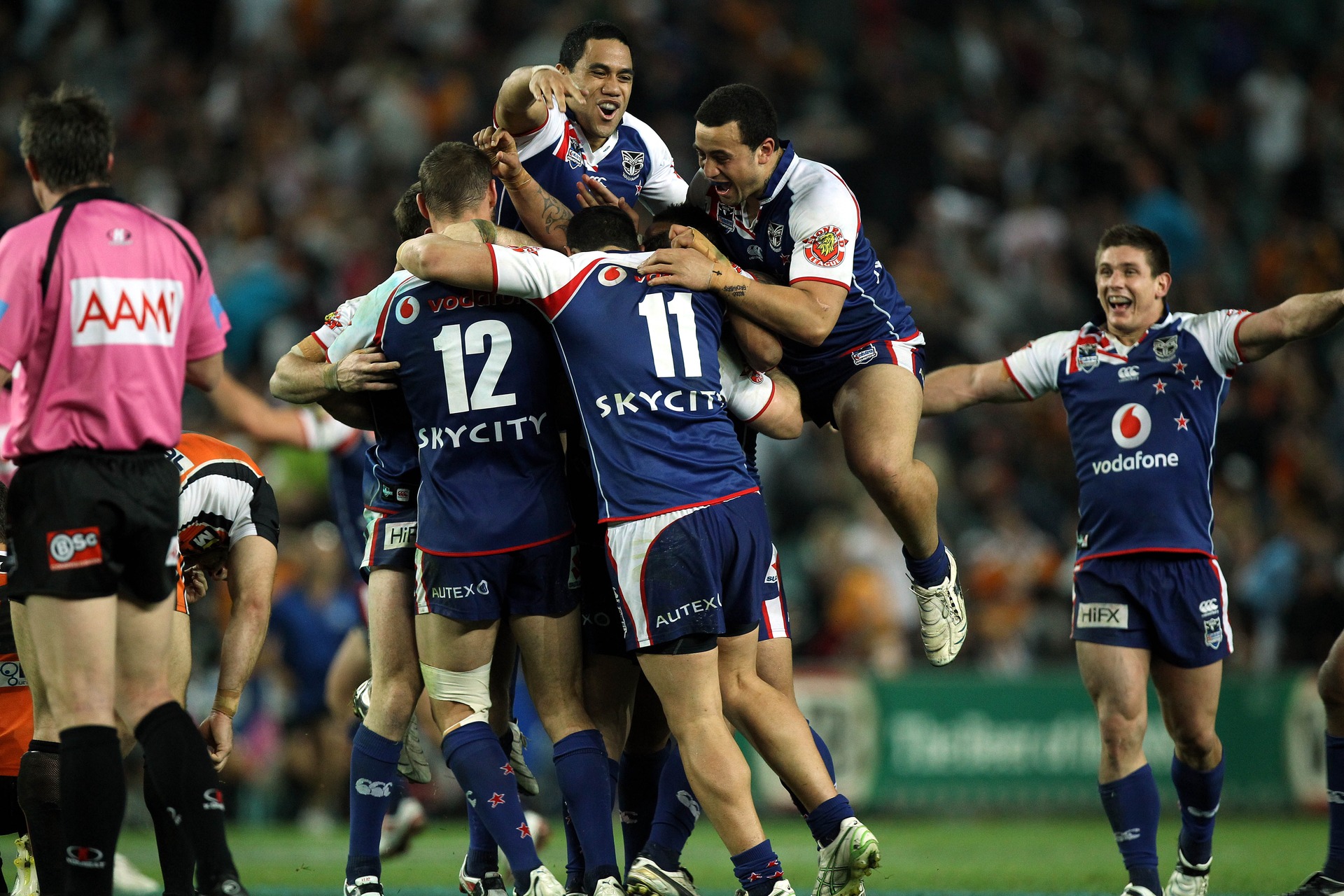 Bill Tupou and Ben Matulino jump on Feleti Mateo (16 September 2011). Photo / Photosport