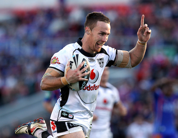 James Maloney makes a break to score during the Warriors grand final run in 2011. Photo / Photosport