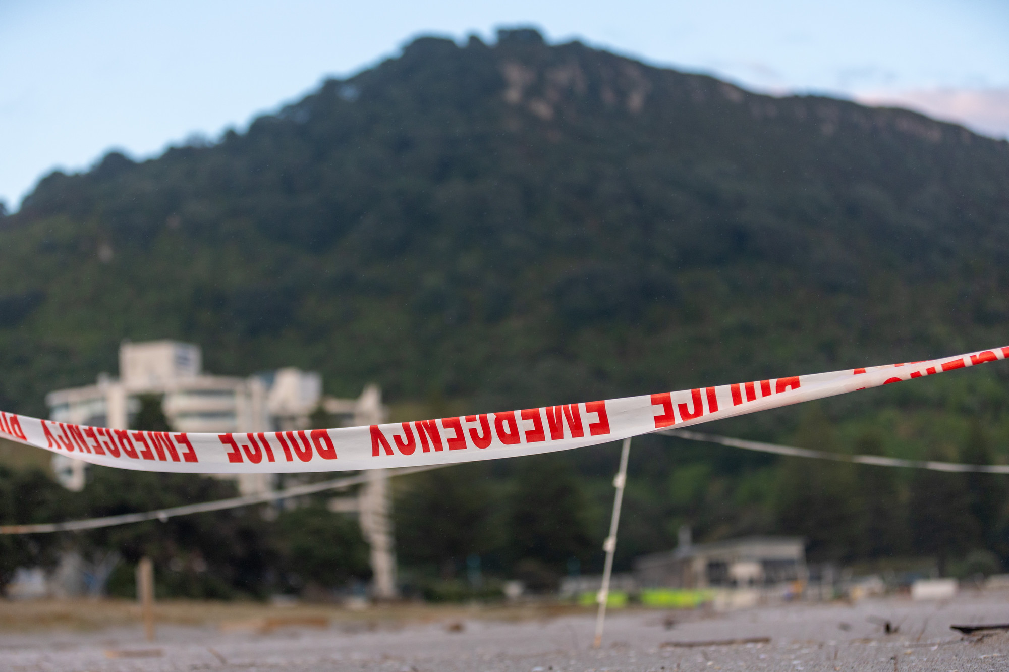Emergency services tape closes Mount Maunganui Beach to the public. Photo / Michael Craig