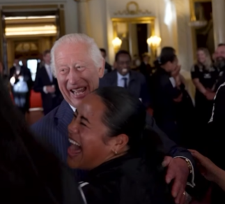 King Charles shares a laugh and a hug with members of the Black Ferns.