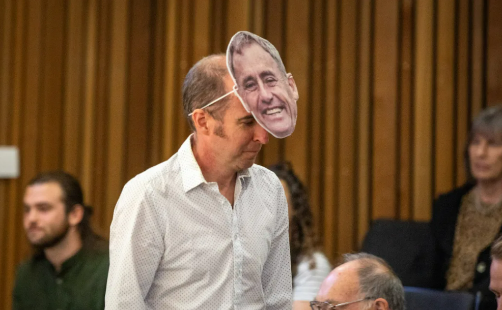 A member of the public wears a Phil Mauger mask at a meeting of the Christchurch City Counci. Photo / Nate McKinnon, RNZ