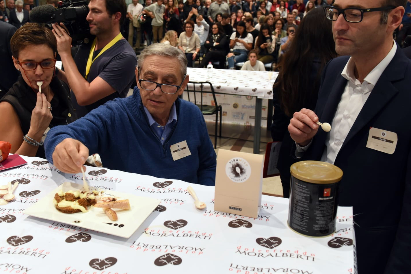 Roberto Linguanotto (centre) samples a tiramisu at the 2018 Tiramisu World Cup near Treviso, Italy. Photo / Tiramisu World Cup