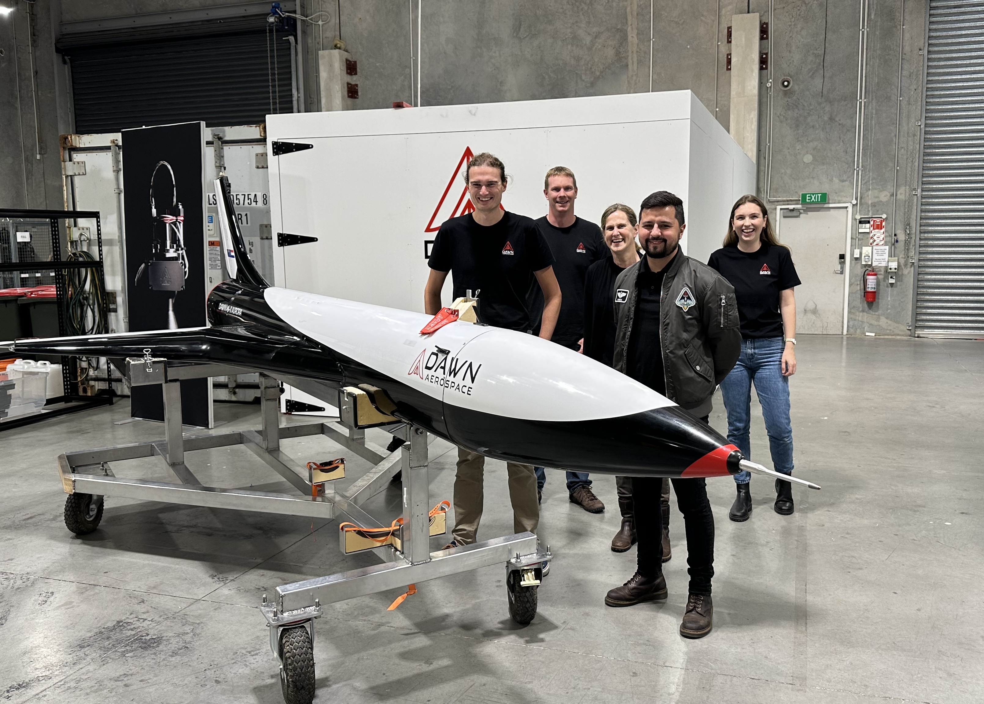 Dawn Aerospace staff including CEO Stefan Powell (front left) and test pilot  Iagho Amaral (front right), with the firm's Mk-II Aurora spaceplane demonstrator. at its Christchurch assembly plant. Photo / Chris Keall