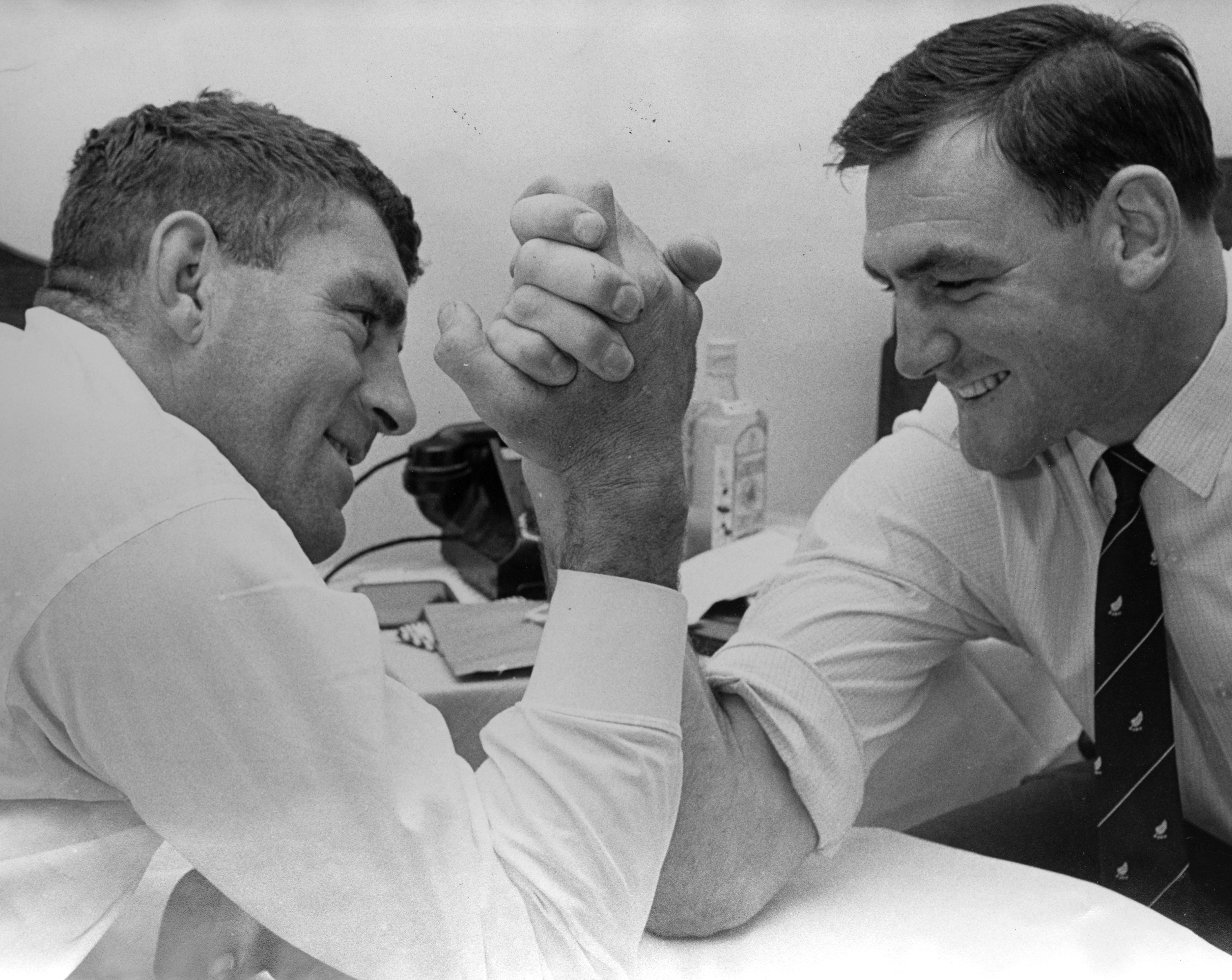 Colin Meads (left) and Brian Lochore practise arm-wrestling in the All Blacks' Sydney hotel in 1968.