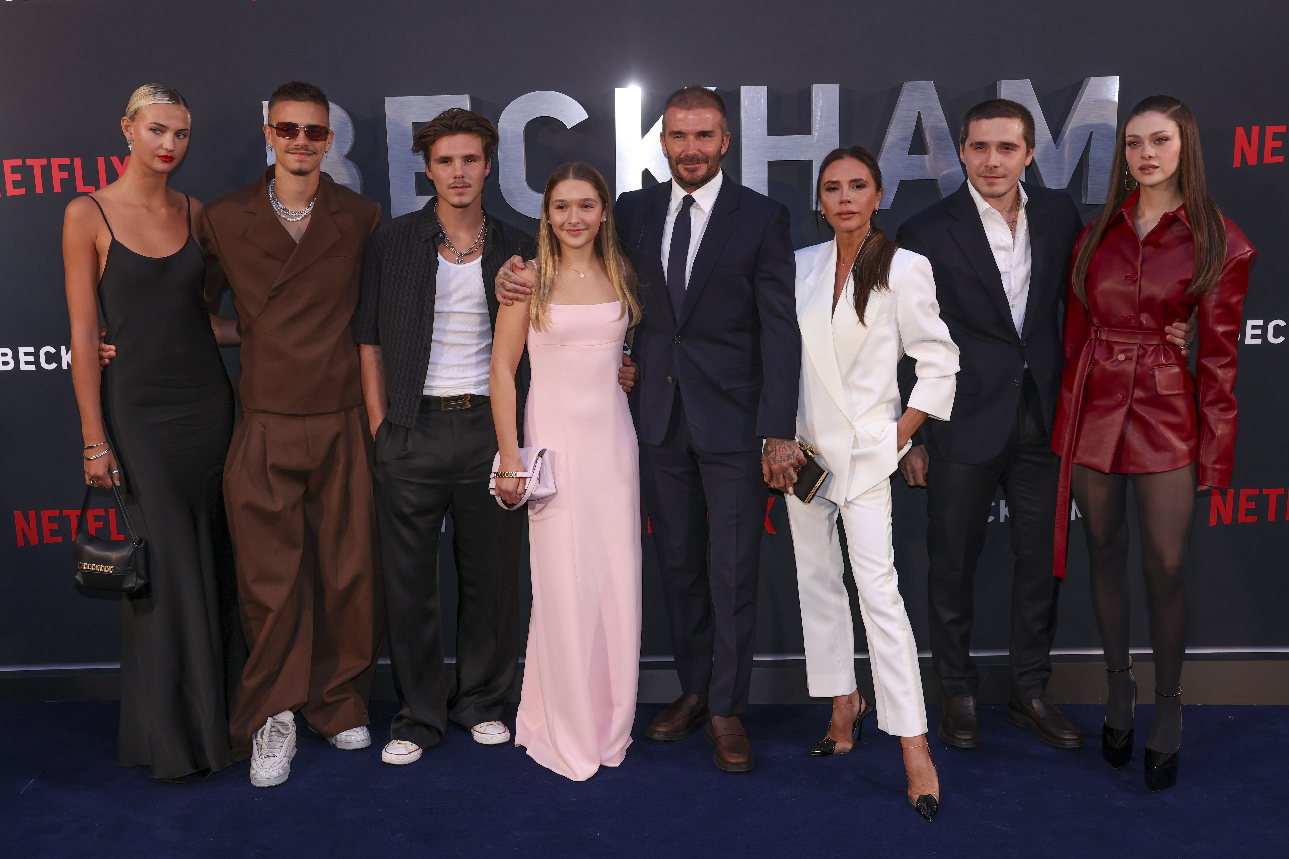 Mia Regan (left), Romeo Beckham, Cruz Beckham, Harper Beckham, David Beckham, Victoria Beckham, Brooklyn Beckham and Nicola Peltz Beckham at the premiere of the TV programme Beckham in London on October 3 last year. Photo / AP