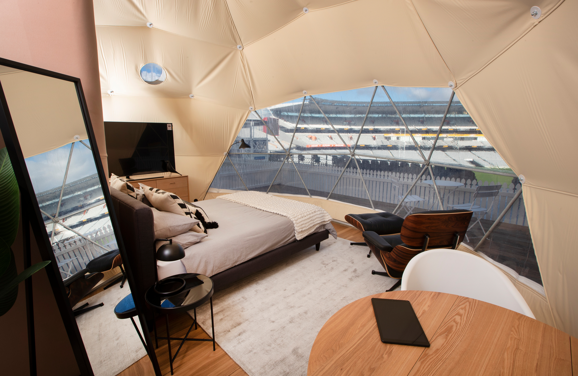 No expense has been spared on widescreen TVs, Eames chairs and bedspreads with high thread counts. Photo / Supplied; Eden Park