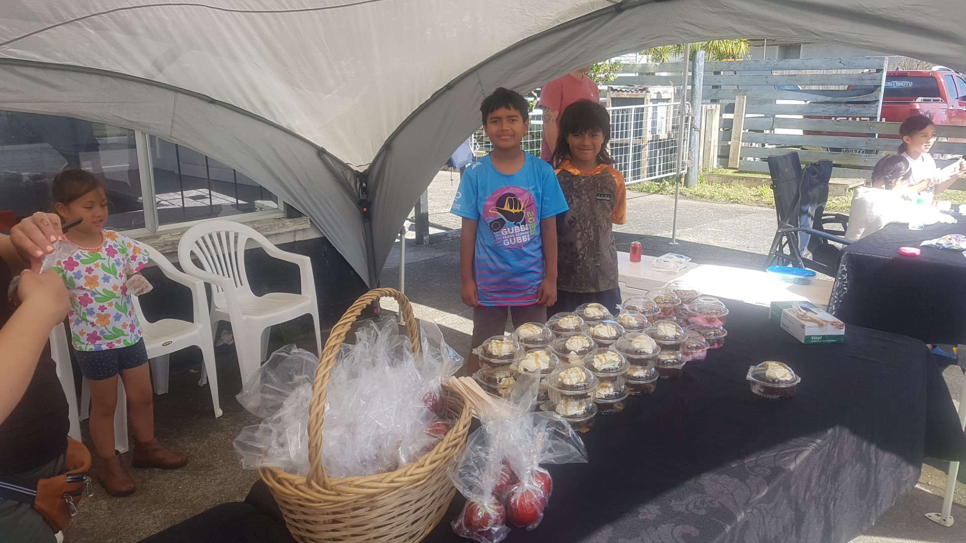 Valley Phelan-Marsden, aged 5, Isaiah Ngamanu-Korewha, 8 and Boaz Marsden, 8, man the sweet stall at the Awanui Day celebrations on Saturday