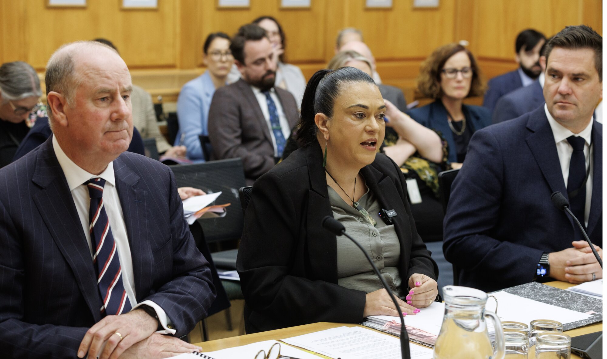 Children Minister Karen Chhour, flanked by Oranga Tamariki chief executive Andrew Bridgman, left, and deputy chief executive Iain Chapman during a Parliamentary select committee hearing. Photo / Mark Mitchell