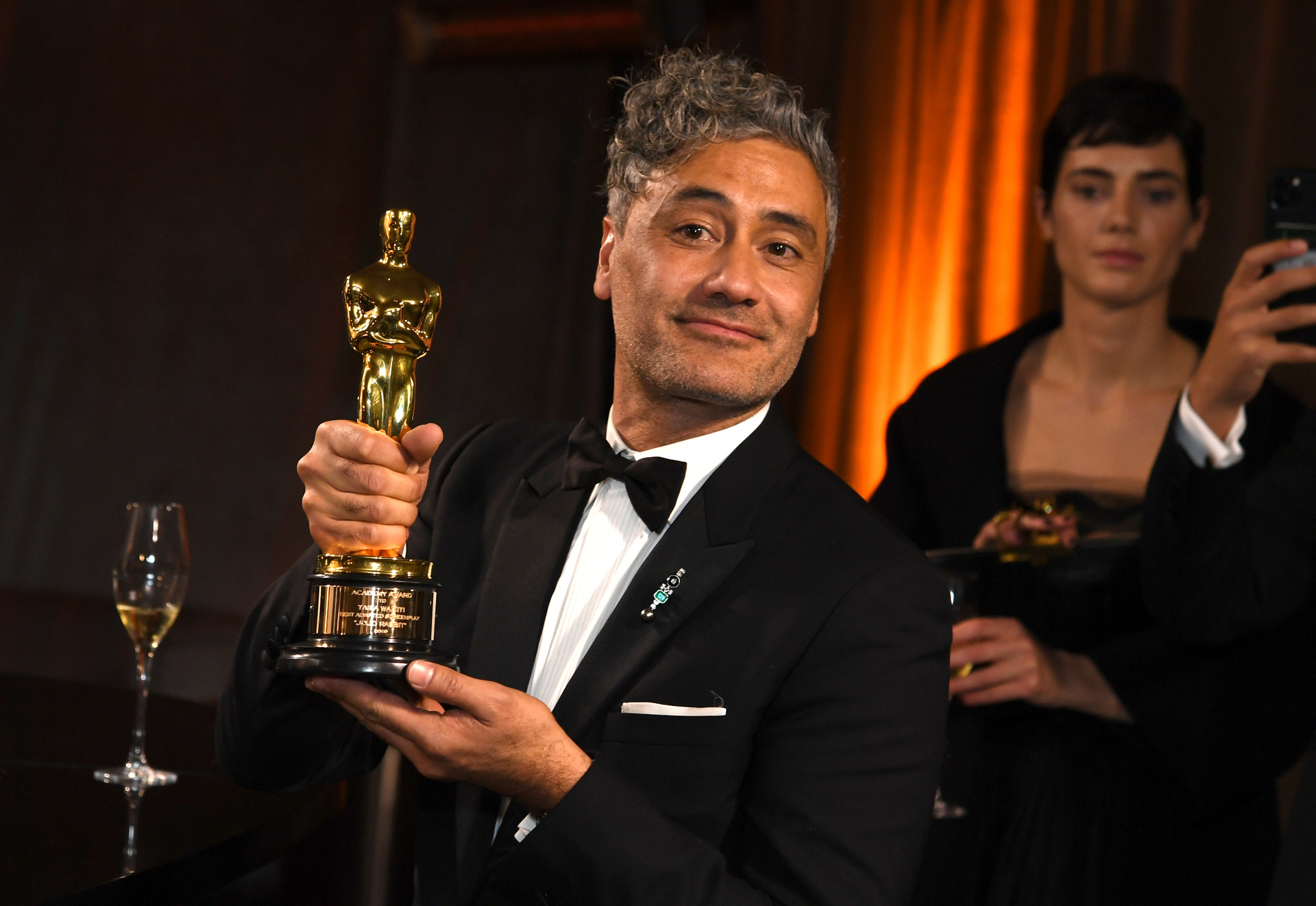 Taika Waititi with his Oscar for best adapted screenplay. Photo / AP