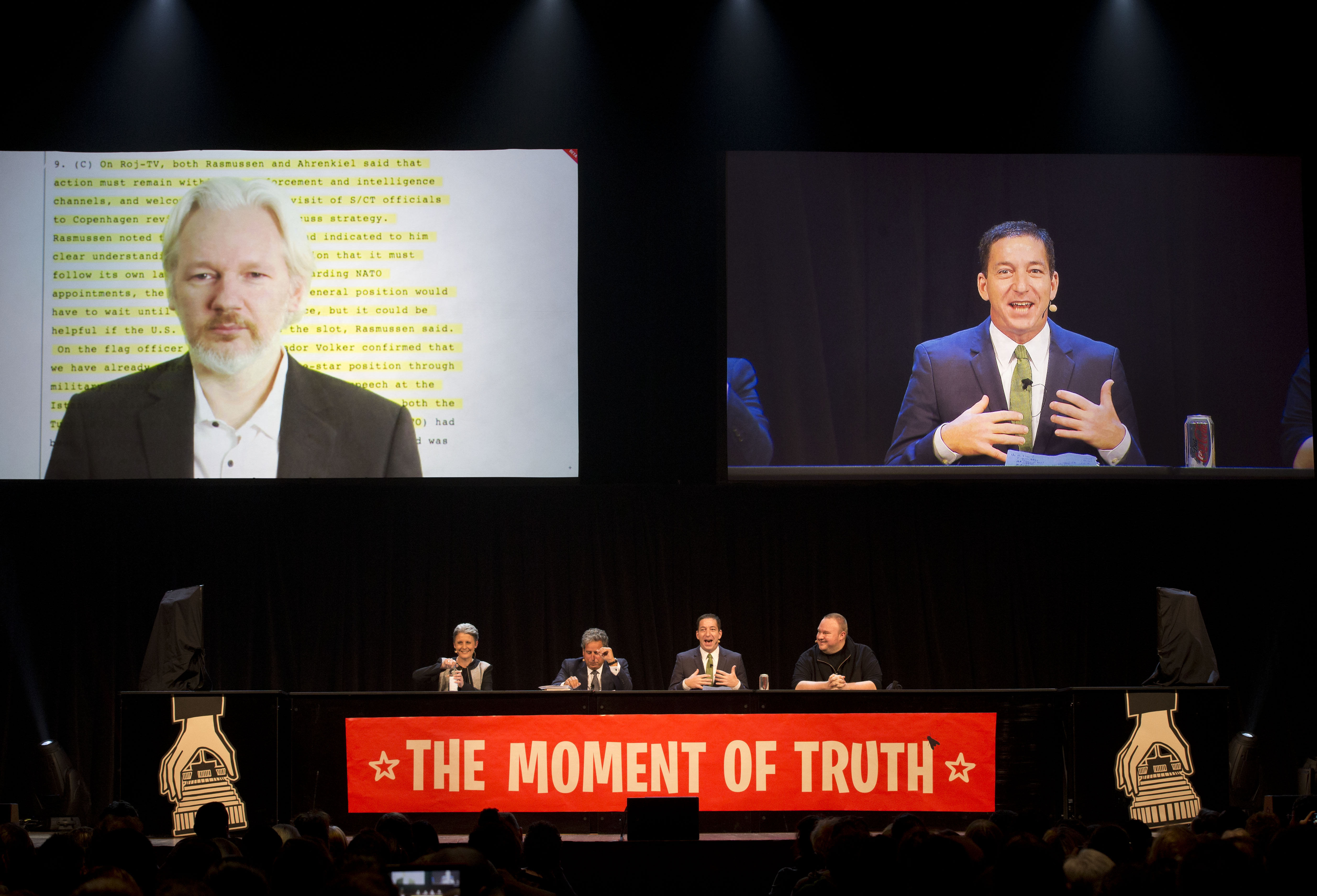 Wikileaks founder Julian Assange, left, speaks via video link with, from left, Laila Harre, international human-rights lawyer Robert Amsterdam, Pulitzer prize-winning journalist and author Glenn Greenwald and entrepreneur Kim Dotcom. Photo / Brett Phibbs
