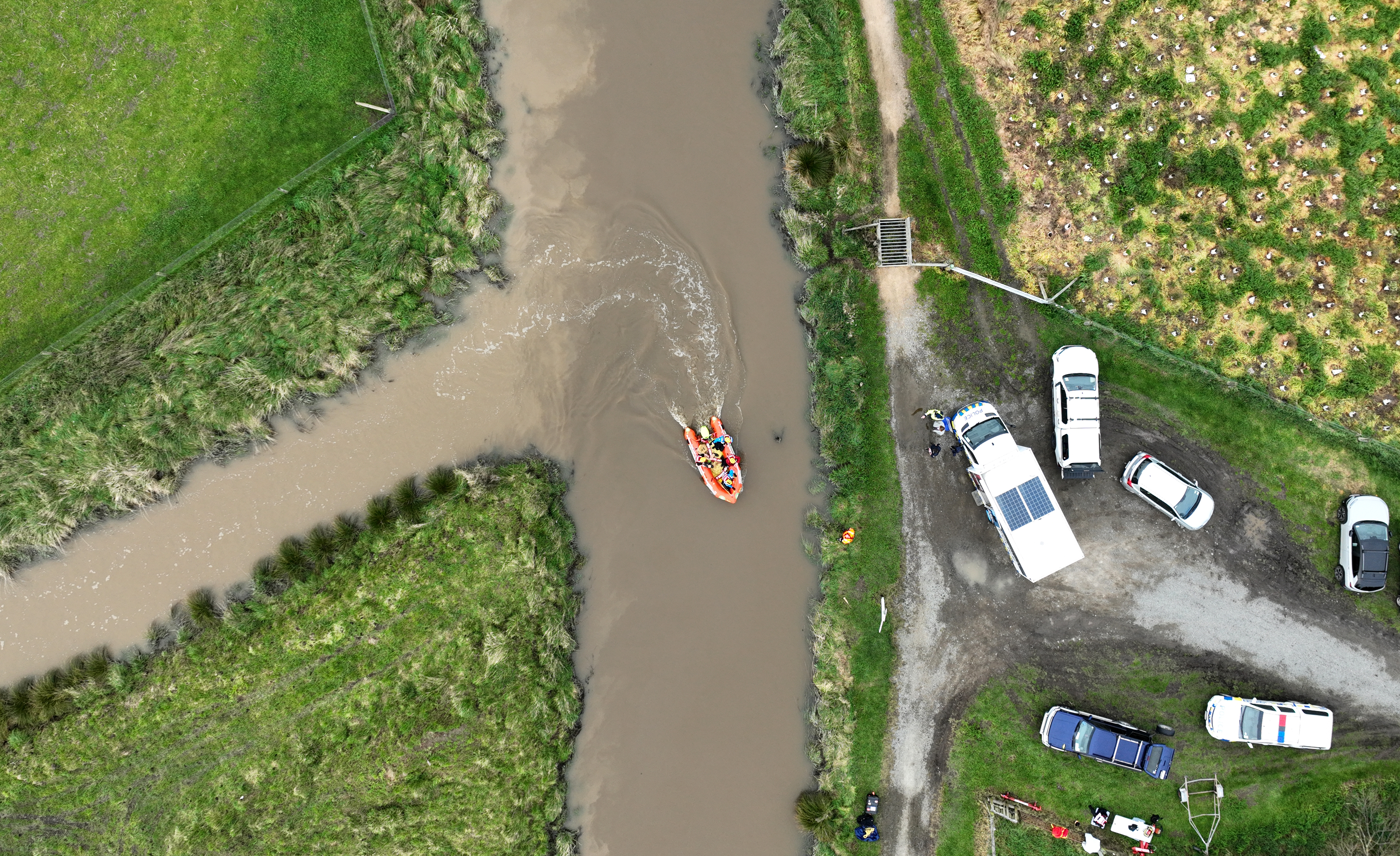 Police searching the Halswell River in relation to the disappearance of Yanfei Bao. Photo / George Heard