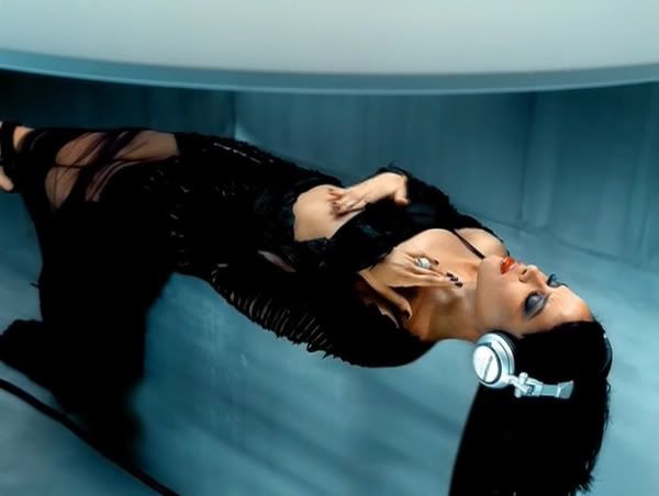 Aaliyah’s ‘We Need a Resolution’ video from 2001 captures the retro-futurism of the early 2000s, complete with oversized headphones.