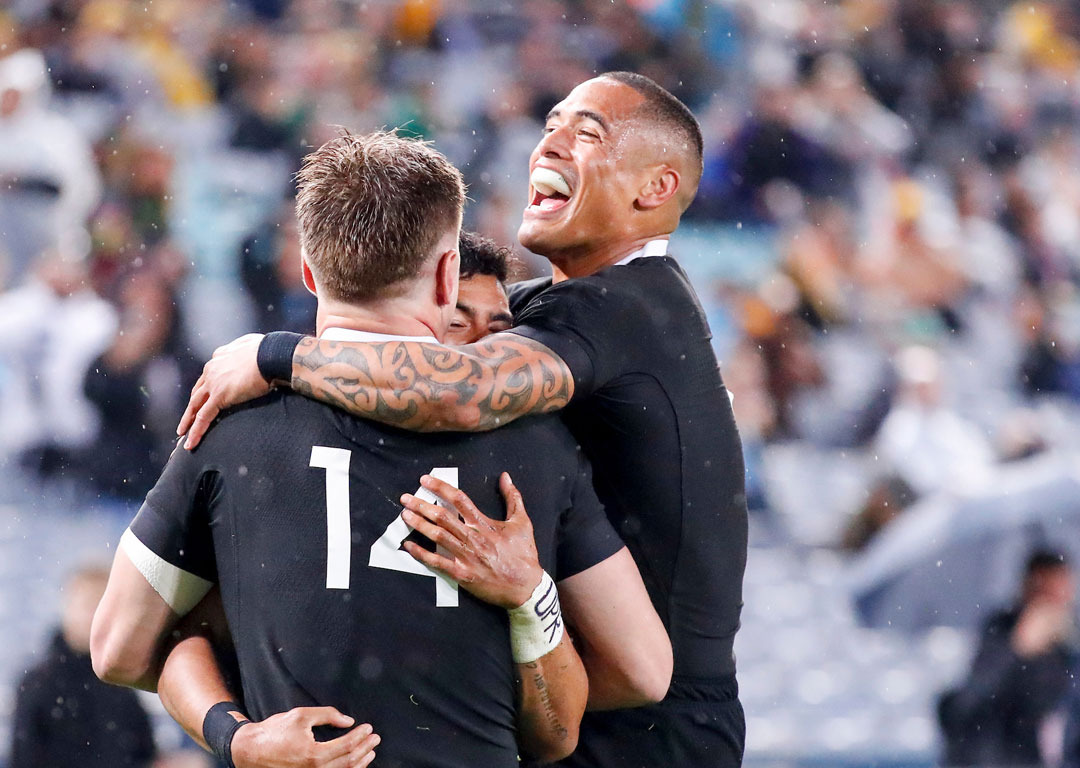 All Black Richie Mo'unga celebrates with Aaron Smith and Jordie Barrett after scoring against the Wallabies. Photosport