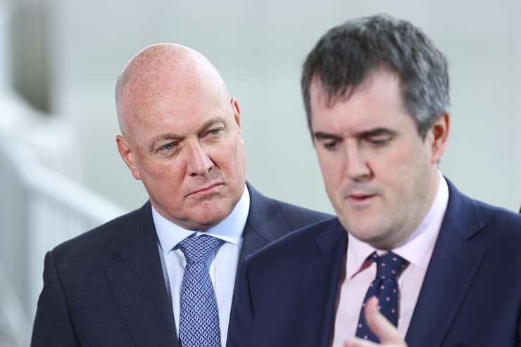 Chris Bishop makes a point while Christopher Luxon looks on. Photo / Getty Images