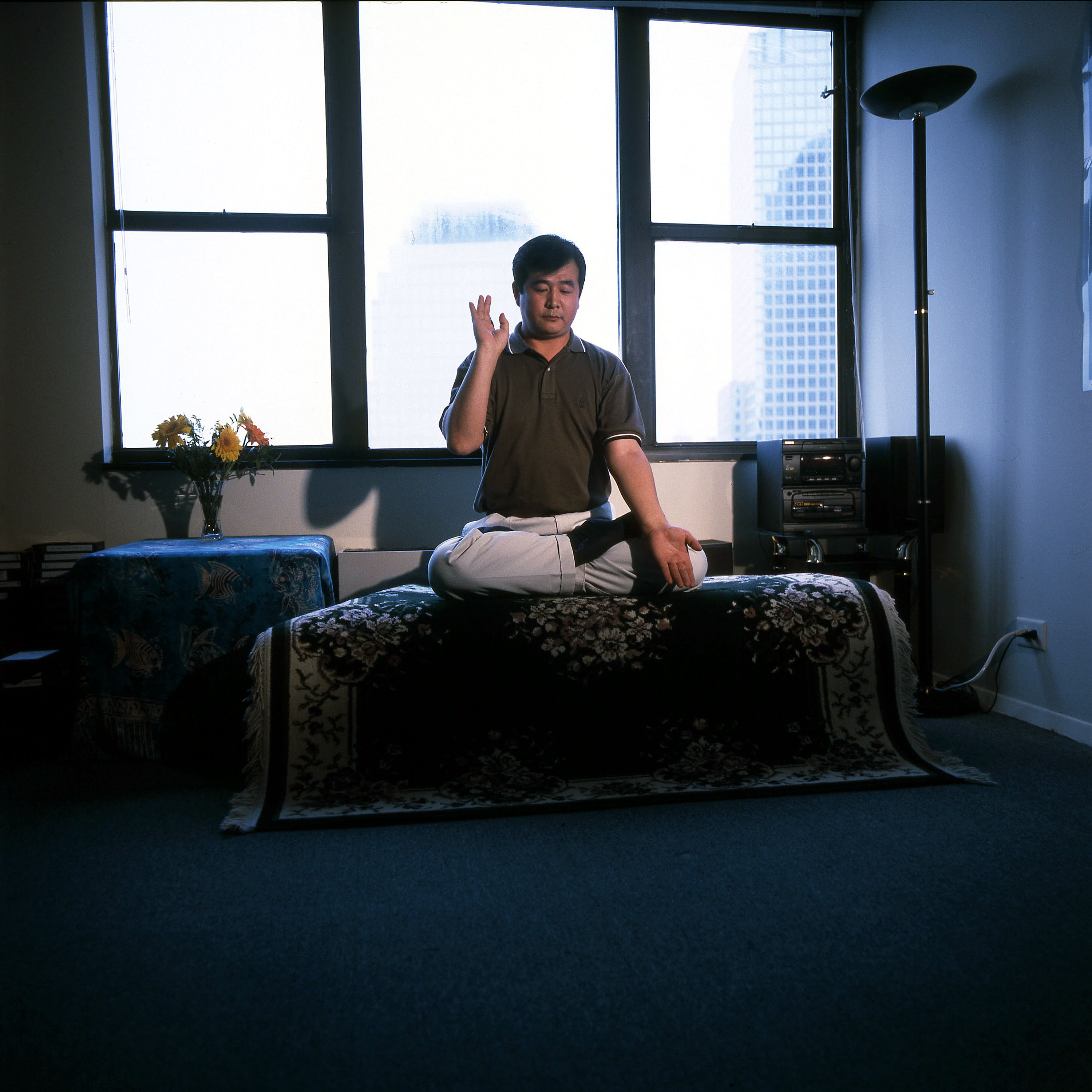 Falun Gong founder Li Hongzhi poses for a portrait in his home on July 28, 1999 in New York city.