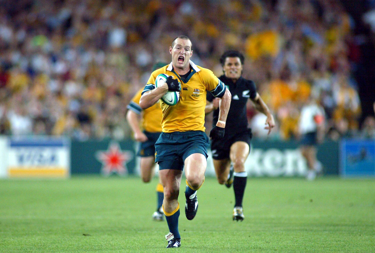 Australia's Stirling Mortlock runs away to score in the 2003 semifinal win over the All Blacks. Photosport