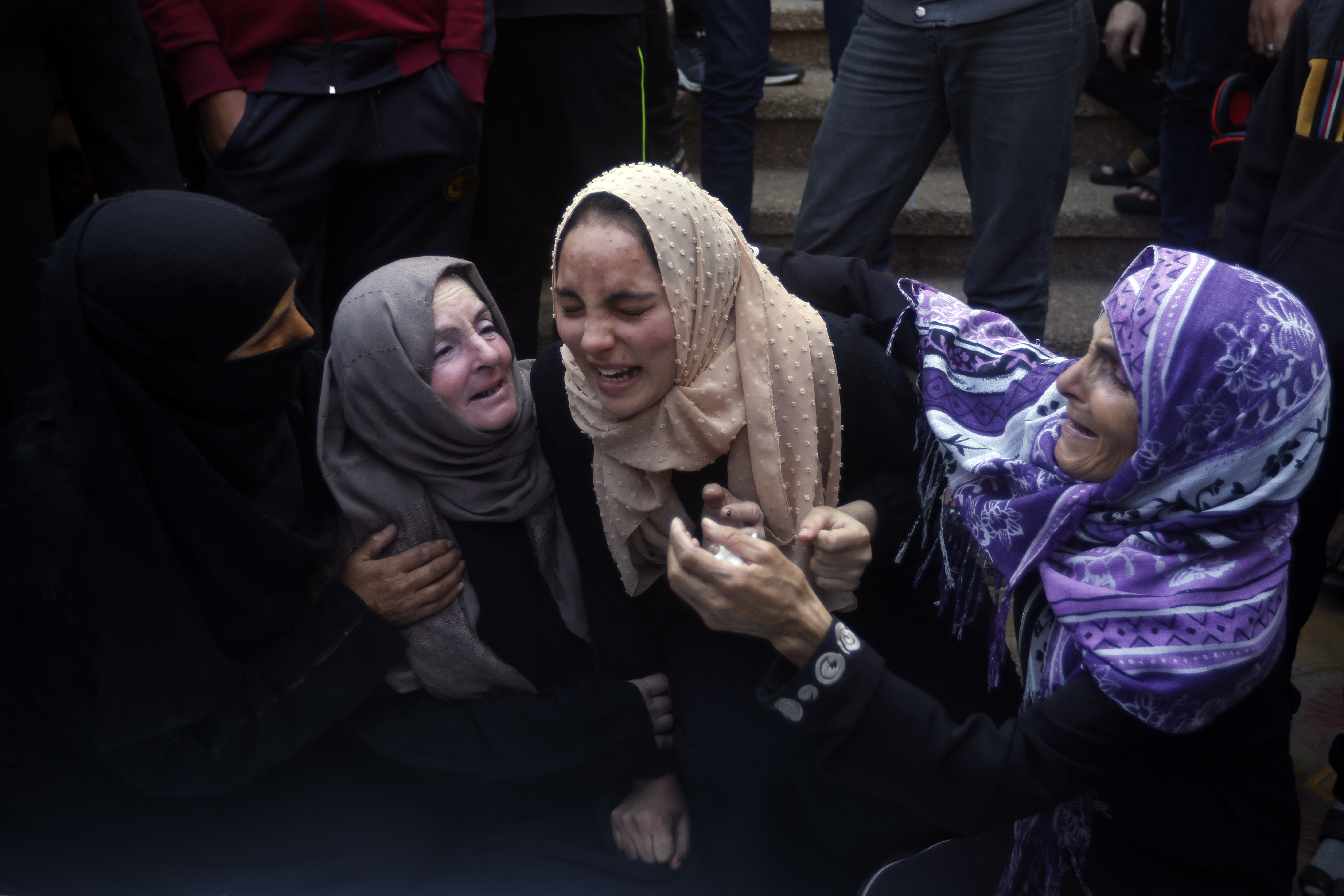 Palestinians mourn relatives killed in an Israeli bombardment of the Gaza Strip, outside a morgue in Kahn Younis. Photo / AP