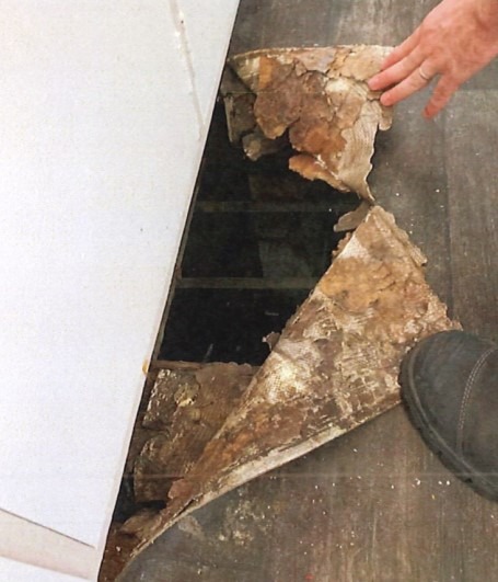 Holes in the floor at Rotorua landlord Stephen Bhana's property.