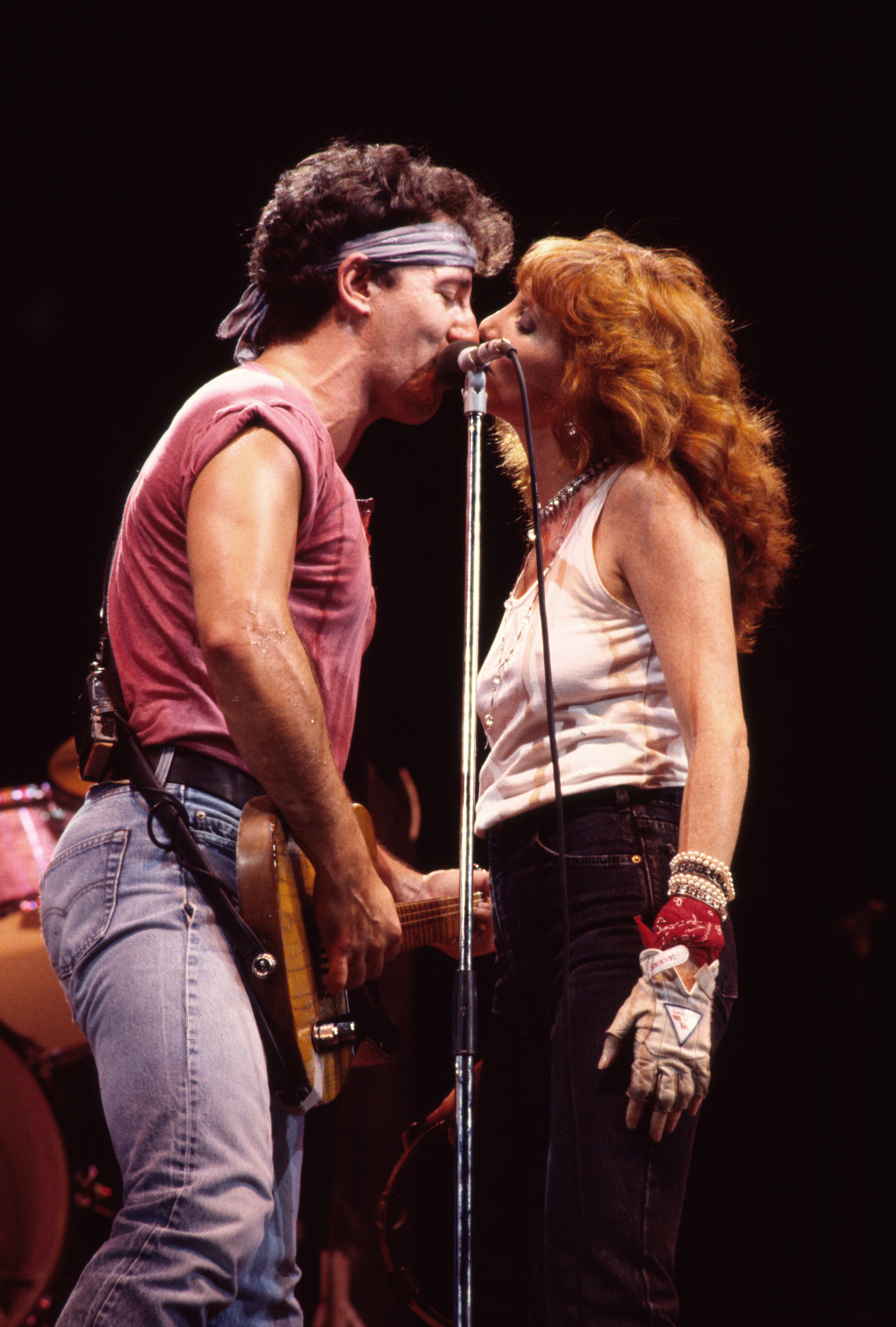 Springsteen and his wife, songwriter Patti Scialfa, on stage in New Jersey in August 1985. Photo / Getty Images
